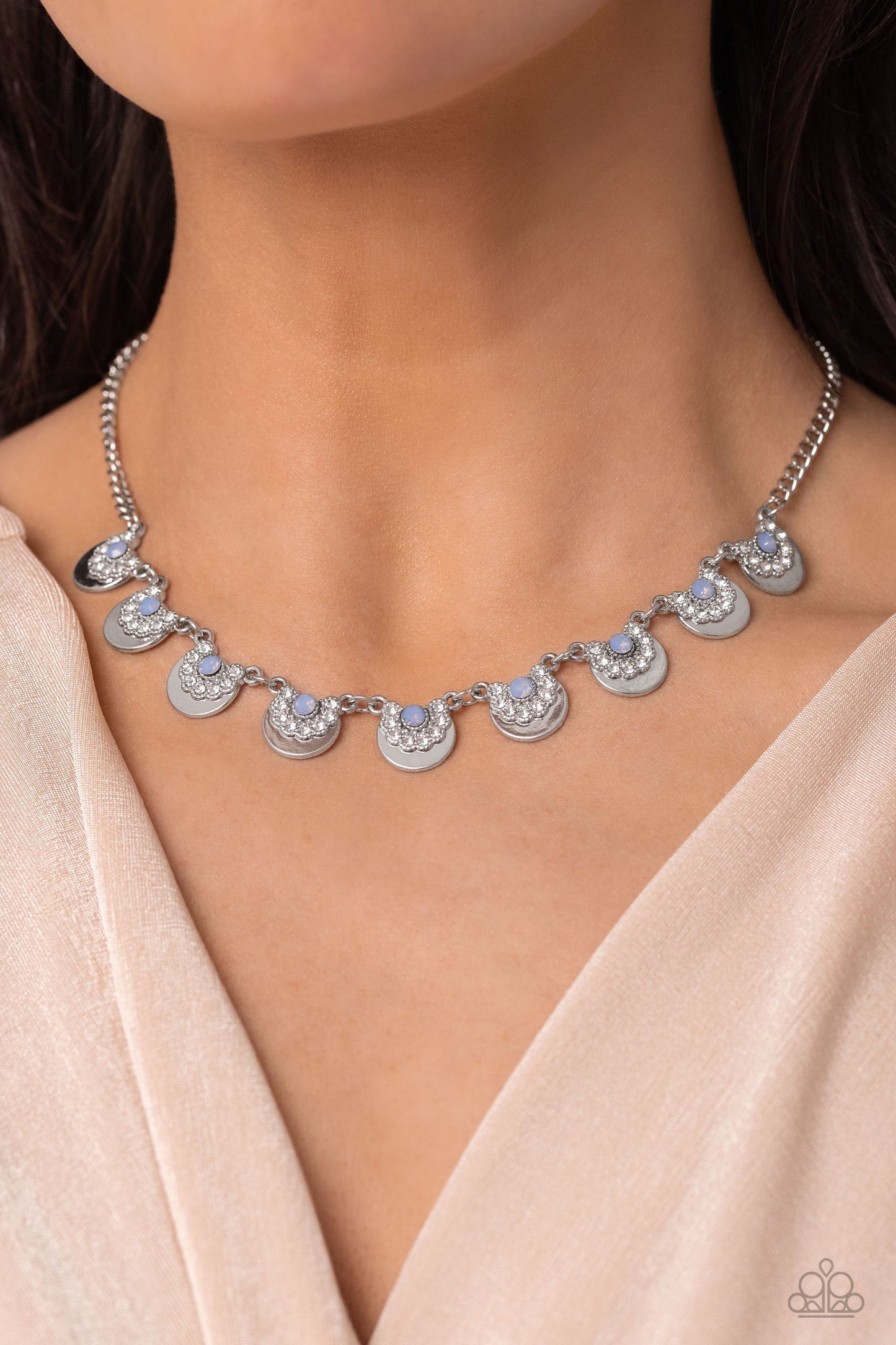 Paparazzi Accessories Grandiose Grace - Blue Featuring white rhinestone curls and silver studded details, dainty silver half-circle frames delicately link together and fan out around the collar for a whimsical fashion. Dainty blue opalescent beads are pre