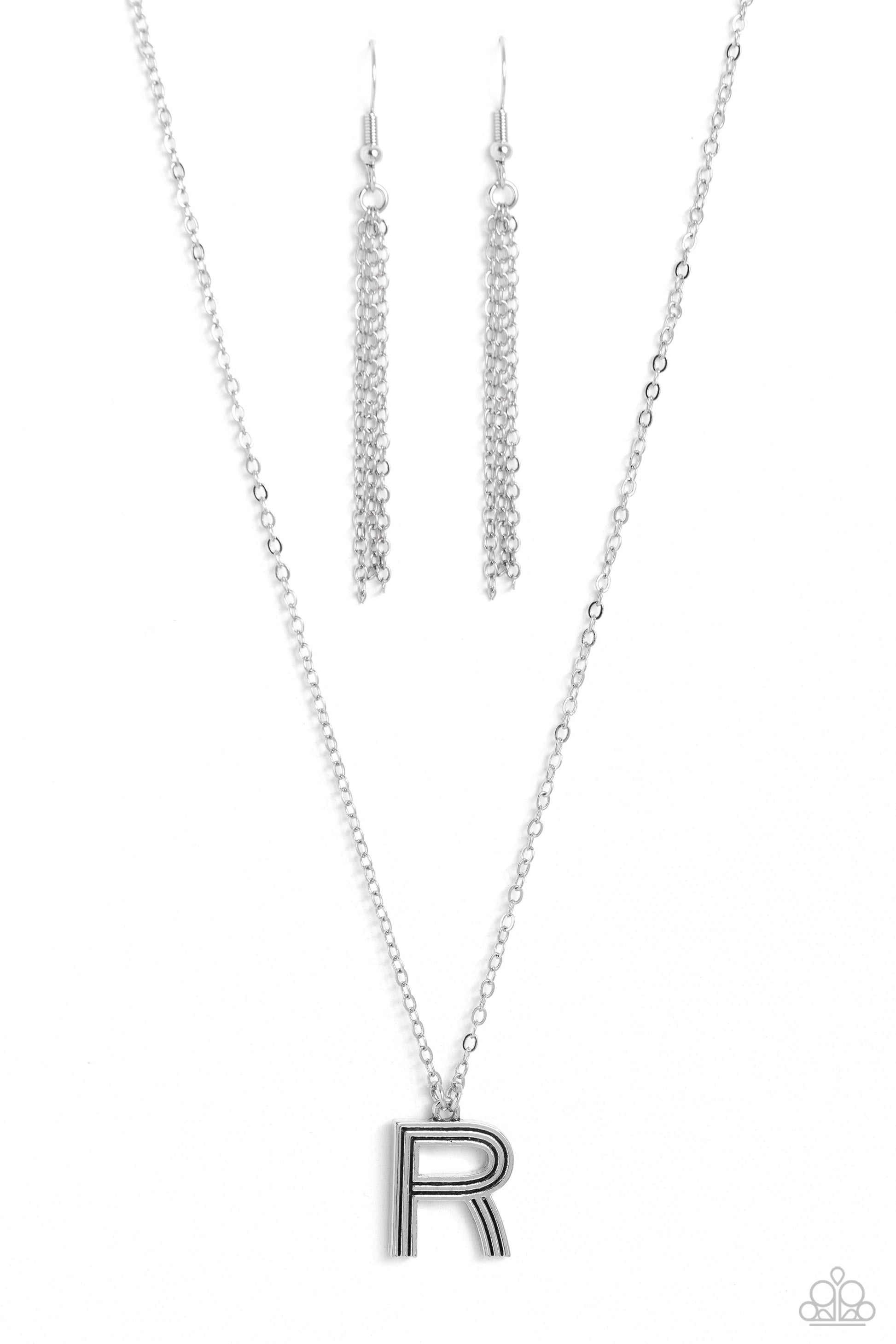 Paparazzi Accessories Leave Your Initials - Silver - R Etched in linear texture, a silver letter "R" hovers below the collar from a dainty silver chain, for a sentimentally simple design. Features an adjustable clasp closure. Sold as one individual neckla