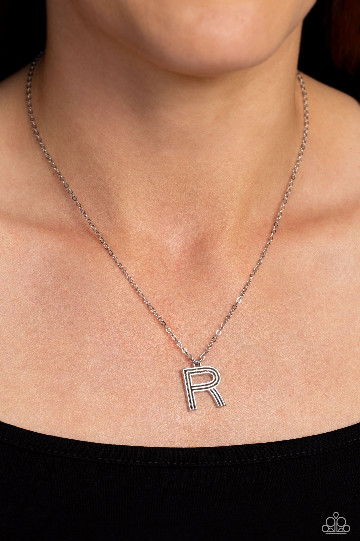 Paparazzi Accessories Leave Your Initials - Silver - R Etched in linear texture, a silver letter "R" hovers below the collar from a dainty silver chain, for a sentimentally simple design. Features an adjustable clasp closure. Sold as one individual neckla
