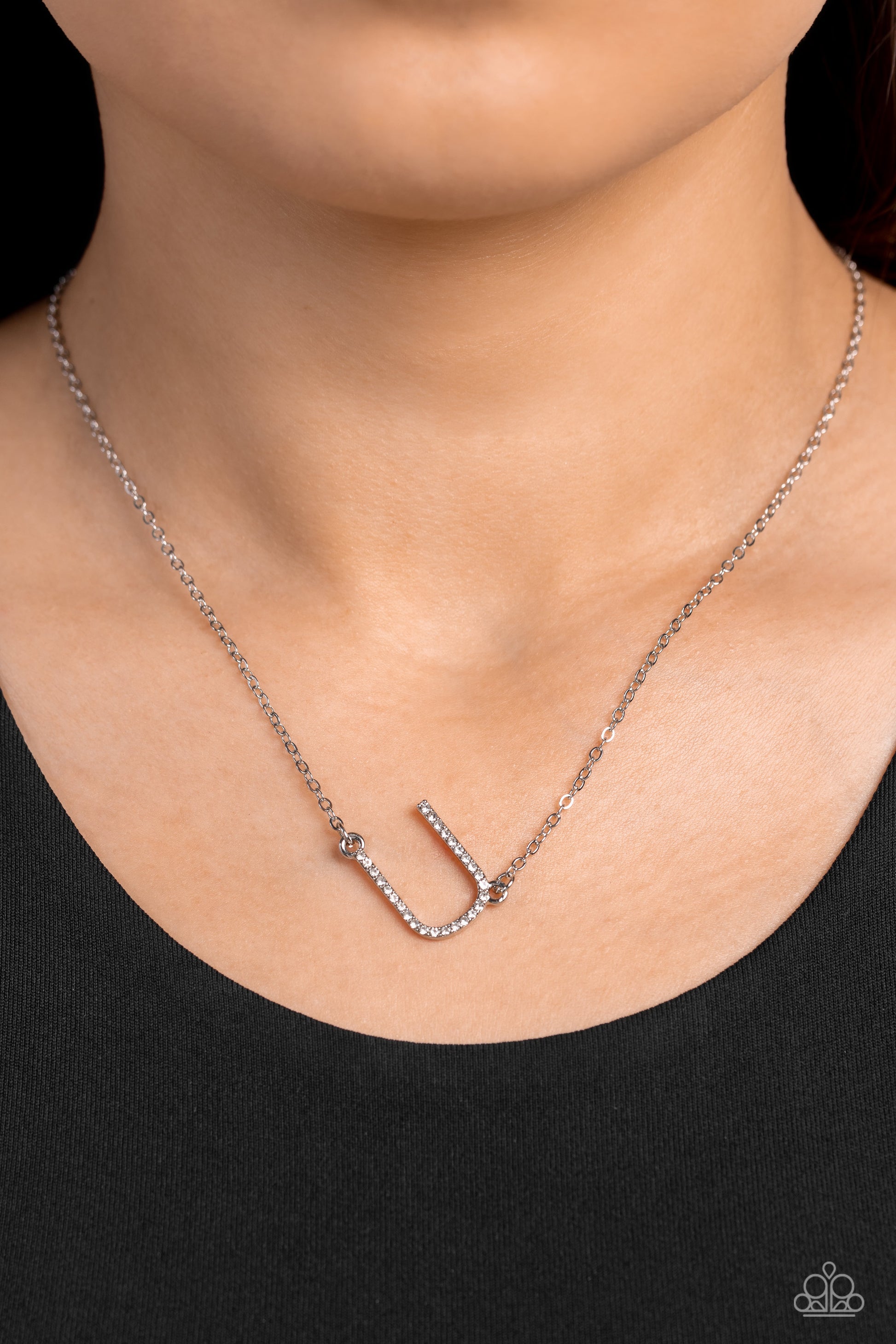Paparazzi Accessories INITIALLY Yours - U - White Embossed with dainty white rhinestones, a silver letter "U" hovers below the collar from a dainty silver chain, for a sentimentally simple design. Features an adjustable clasp closure. Sold as one individu