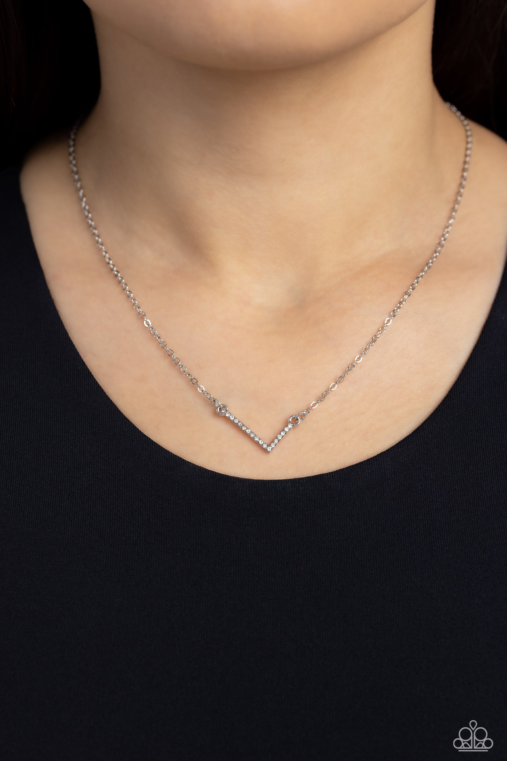 Paparazzi Accessories INITIALLY Yours - L - White Embossed with dainty white rhinestones, a silver letter "L" hovers below the collar from a dainty silver chain, for a sentimentally simple design. Features an adjustable clasp closure. Sold as one individu