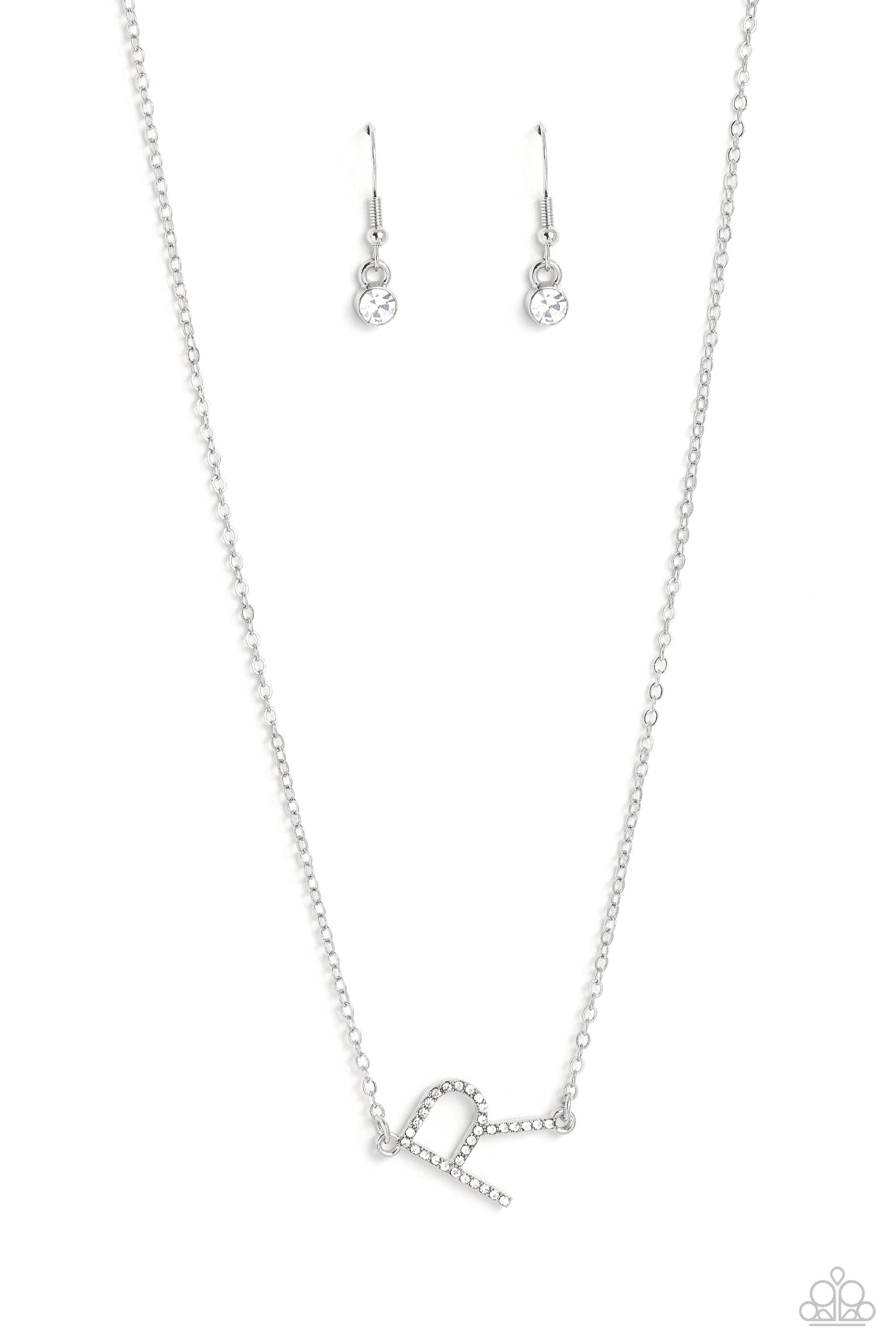 Paparazzi Accessories INITIALLY Yours - R - White Embossed with dainty white rhinestones, a silver letter "R" hovers below the collar from a dainty silver chain, for a sentimentally simple design. Features an adjustable clasp closure. Sold as one individu