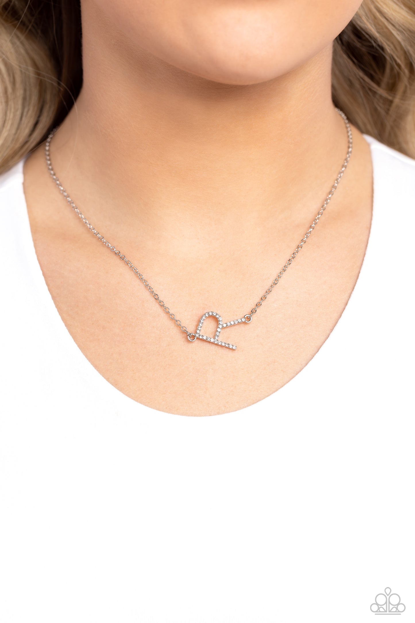 Paparazzi Accessories INITIALLY Yours - R - White Embossed with dainty white rhinestones, a silver letter "R" hovers below the collar from a dainty silver chain, for a sentimentally simple design. Features an adjustable clasp closure. Sold as one individu
