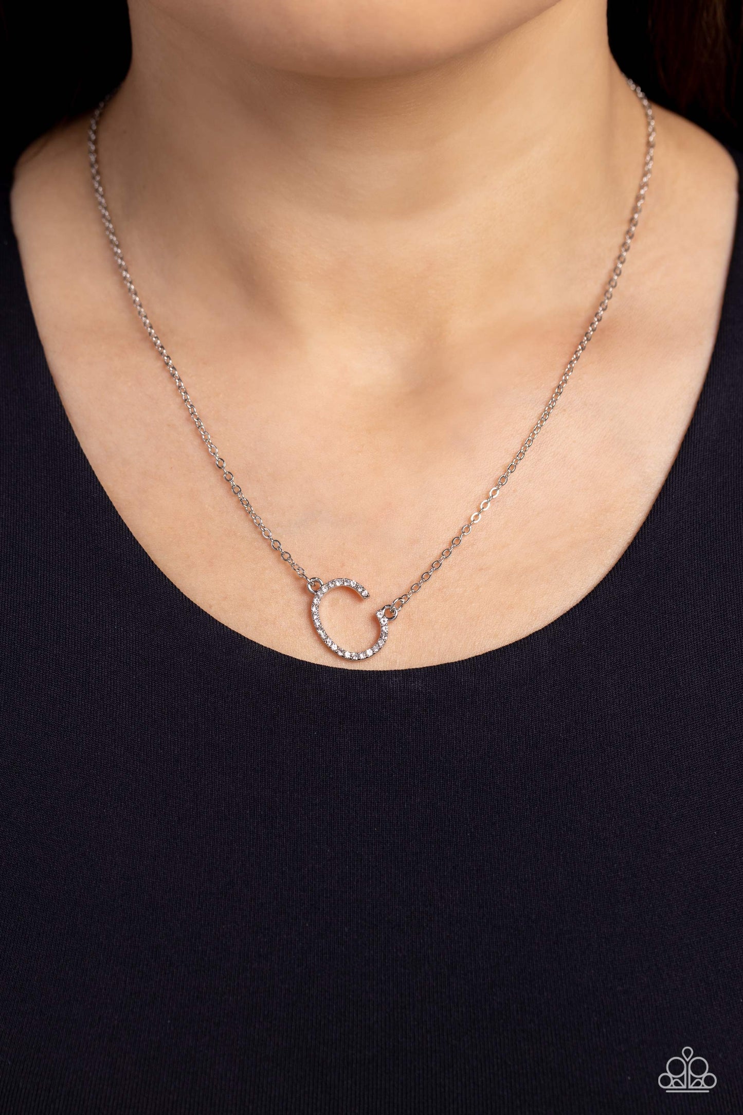 Paparazzi Accessories INITIALLY Yours - C - White Embossed with dainty white rhinestones, a silver letter "C" hovers below the collar from a dainty silver chain, for a sentimentally simple design. Features an adjustable clasp closure. Sold as one individu