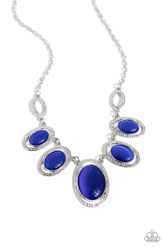 Paparazzi Accessories A BEAM Come True - Blue Featuring white rhinestone encrusted oval frames, a mesmerizing collection of glowing blue cat's eye stones delicately link below the collar for an ethereal pop of color. Features an adjustable clasp closure.