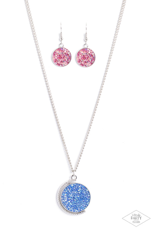 Paparazzi Accessories My Moon and Stars - Multi A smoldering collision of blue iridescent and pink iridescent rhinestones are encrusted across the front and back of a textured silver disc below the collar. Threaded along a dainty rod, the glittery pendant