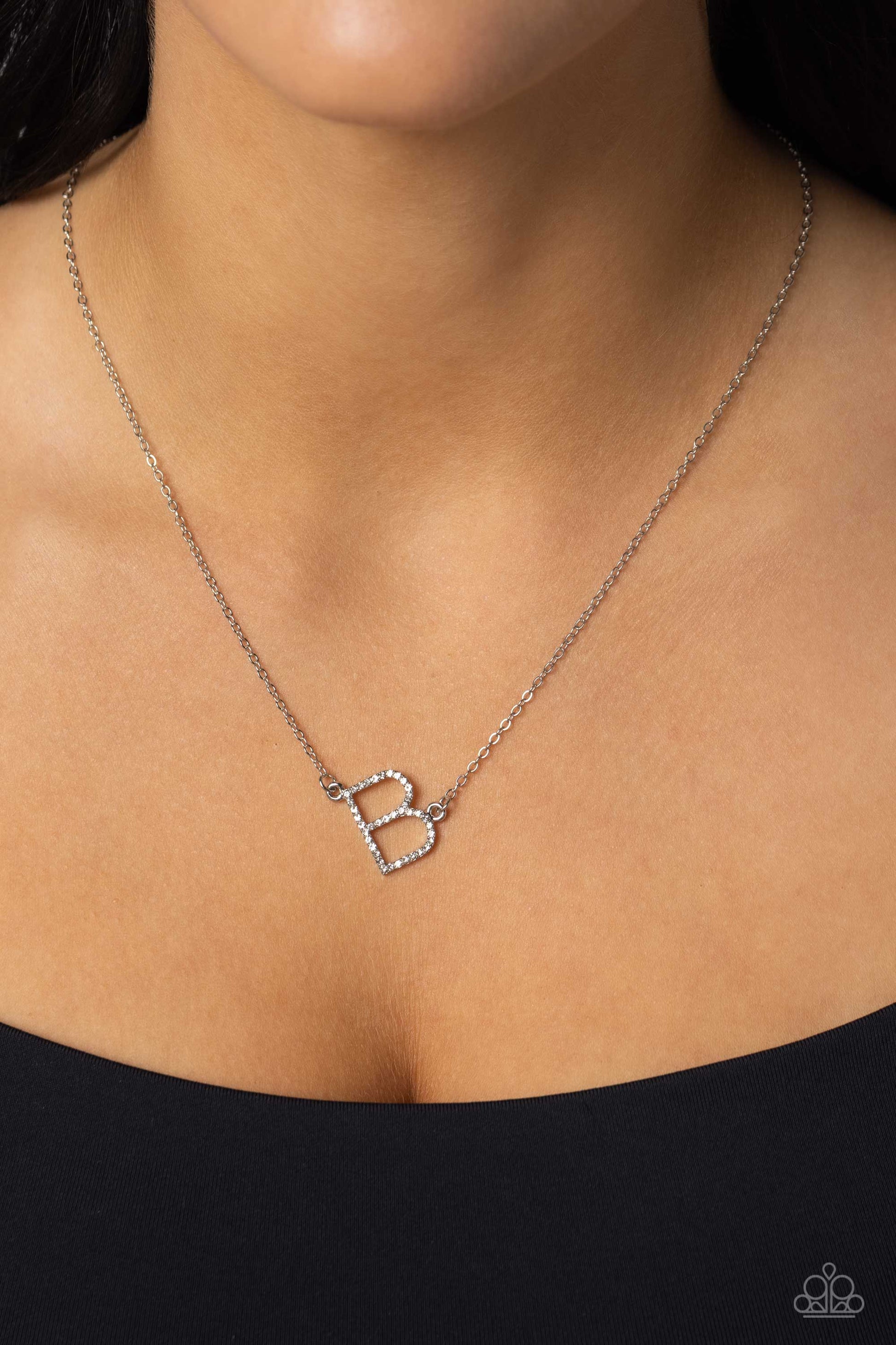 Paparazzi Accessories INITIALLY Yours - B - White Embossed with dainty white rhinestones, a silver letter "B" hovers below the collar from a dainty silver chain, for a sentimentally simple design. Features an adjustable clasp closure. Sold as one individu