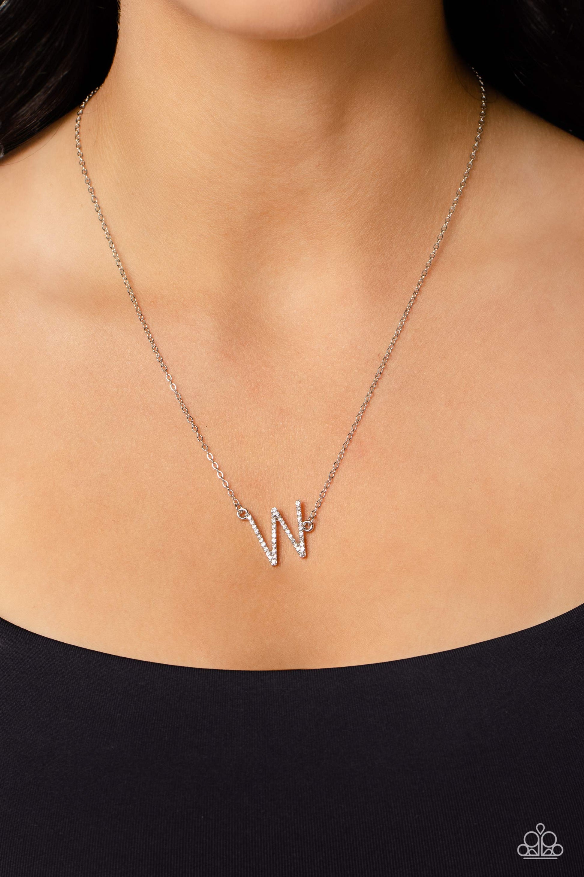 Paparazzi Accessories INITIALLY Yours - W - White Embossed with dainty white rhinestones, a silver letter "W" hovers below the collar from a dainty silver chain, for a sentimentally simple design. Features an adjustable clasp closure. Sold as one individu