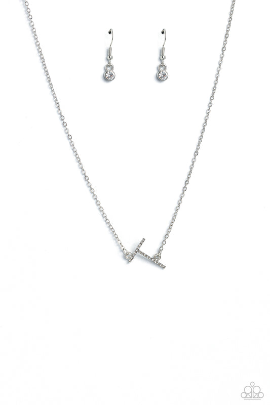 Paparazzi Accessories INITIALLY Yours - T - White Embossed with dainty white rhinestones, a silver letter "T" hovers below the collar from a dainty silver chain, for a sentimentally simple design. Features an adjustable clasp closure. Sold as one individu