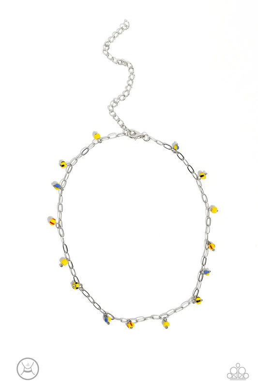 Paparazzi Accessories Beach Ball Bliss - Yellow Featuring multicolored spots, bright yellow seed beads dangle along a single dainty silver link chain for a beachy flair. Features an adjustable clasp closure. Sold as one individual choker necklace. Include