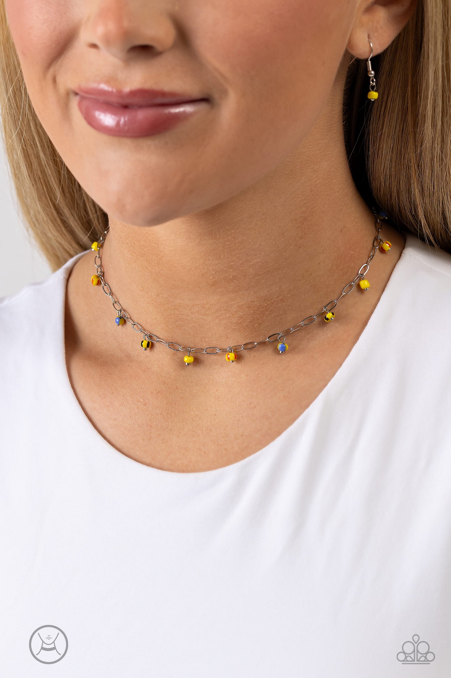 Paparazzi Accessories Beach Ball Bliss - Yellow Featuring multicolored spots, bright yellow seed beads dangle along a single dainty silver link chain for a beachy flair. Features an adjustable clasp closure. Sold as one individual choker necklace. Include