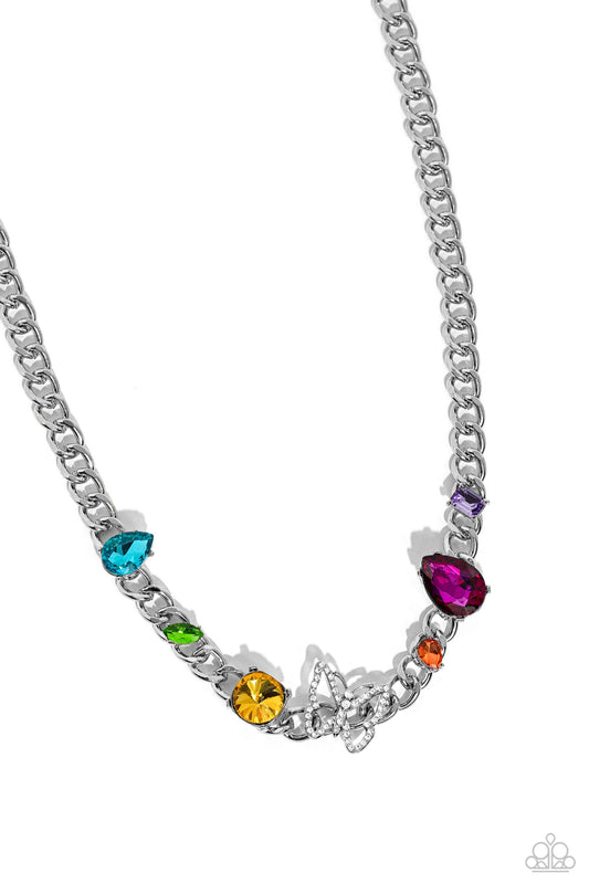 Paparazzi Accessories Storybook Succession - Multi A succession of various gleaming, multicolored gems encased in silver fittings are affixed to a high-sheen, thick silver curb chain, adding dramatic dimension and color to an industrial statement. An airy