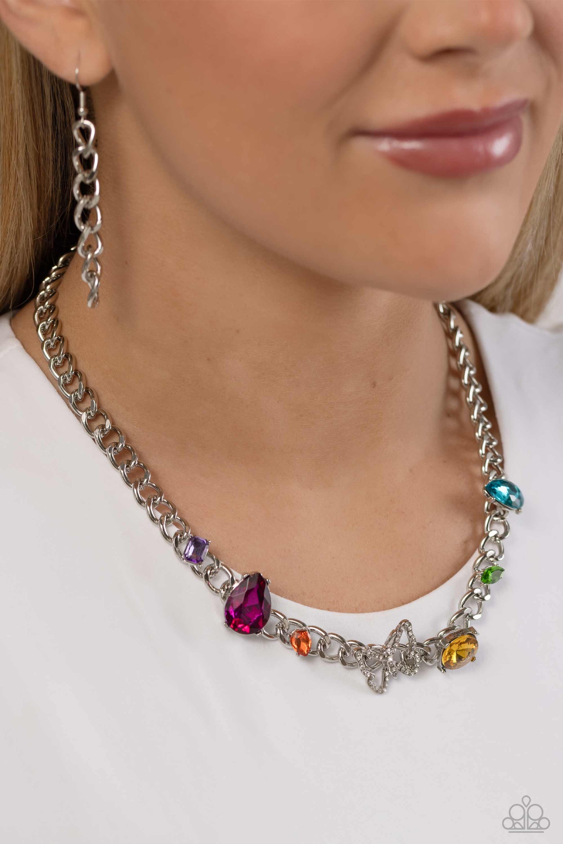 Paparazzi Accessories Storybook Succession - Multi A succession of various gleaming, multicolored gems encased in silver fittings are affixed to a high-sheen, thick silver curb chain, adding dramatic dimension and color to an industrial statement. An airy