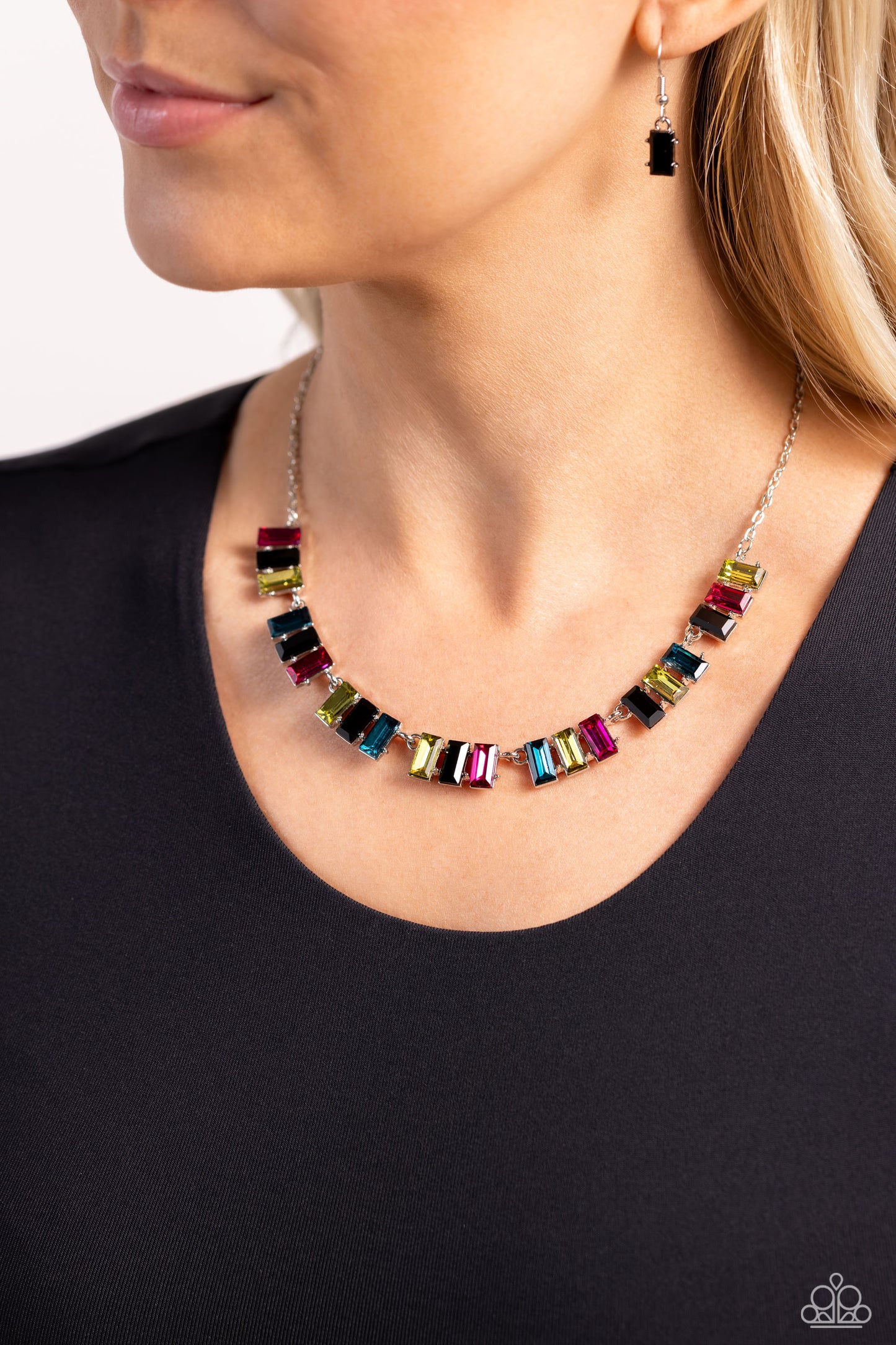 Paparazzi Accessories Elite Emeralds - Black Featuring pronged frames of three, emerald-cut bars splashed in glassy blue, yellow, black, and pink hues collect along a dainty silver chain down the neckline for a refined pop of color. Features an adjustable