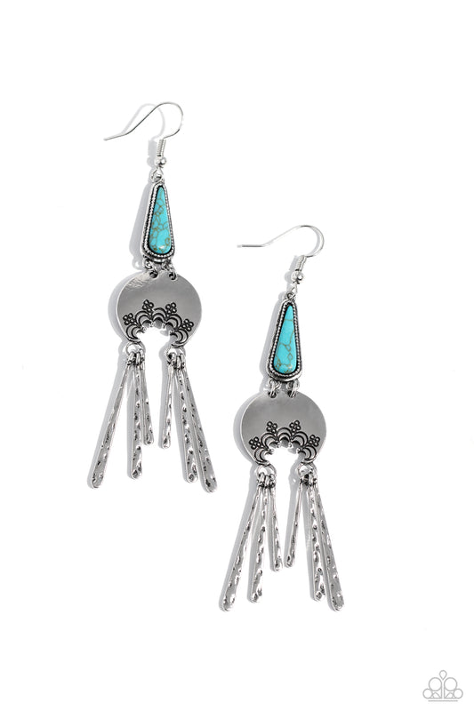 Paparazzi Accessories Highland Haute - Blue A turquoise stone pressed in a studded triangular fitting, and a silver floral-decorated half moon frame link into an earthy lure. A collection of daintily textured silver tassels in varying sizes swing from the