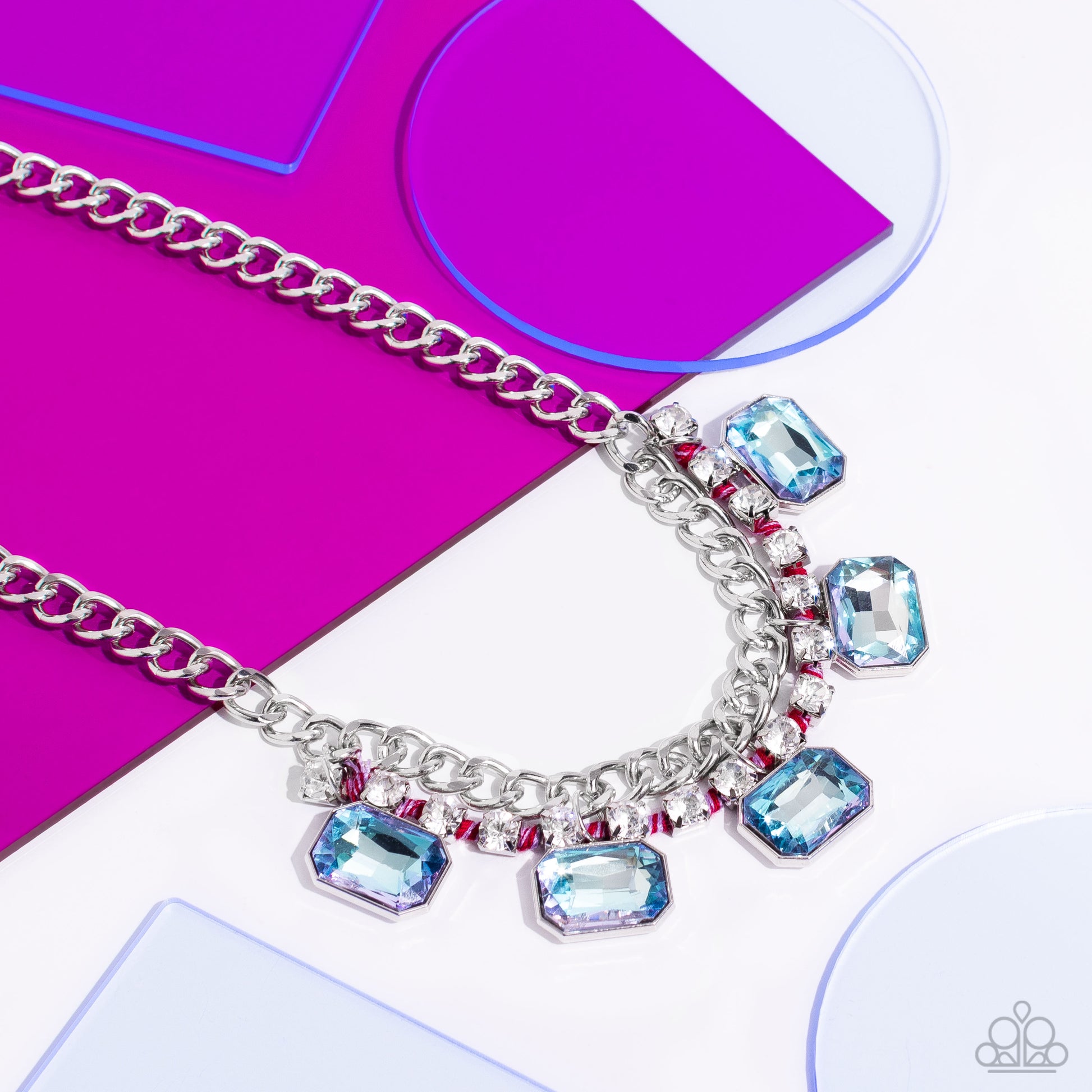 Paparazzi Accessories WEAVING Wonder - Multi Brushed in a high-sheen finish, a strand of flat silver curb chain dramatically drapes across the chest for a bold industrial look. A row of faceted light blue emerald-cut gems cascade from the bottom of a stra