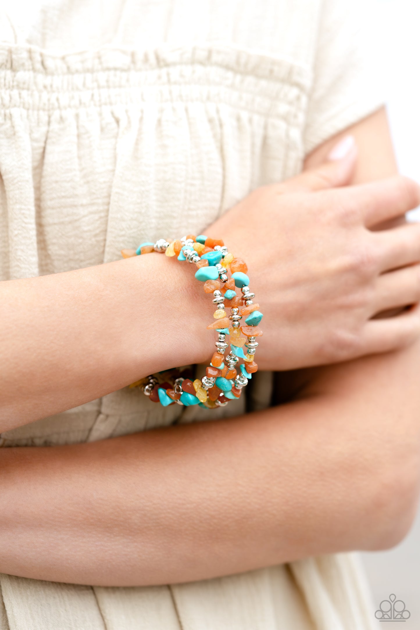Paparazzi Accessories Stacking Stones - Orange Featuring a chiseled finish, a mismatched collection of orange, turquoise, and yellow stones and shiny silver beads are threaded along a coiled wire, creating an earthy infinity wrap style bracelet. As the st