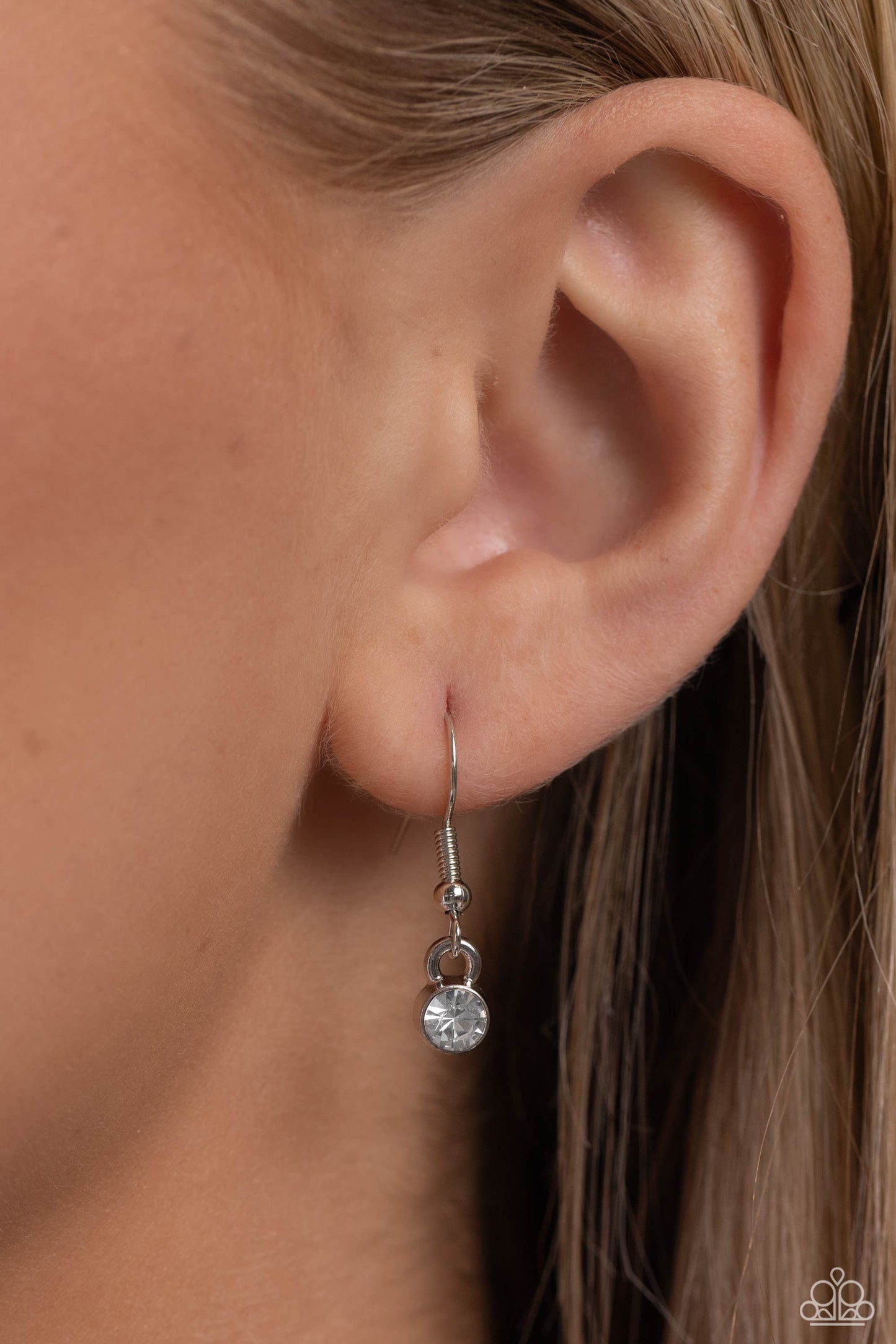 Paparazzi Accessories PET in Motion - White Featuring a paw print charm, an airy rhinestone-embossed heart frame glides down the neckline on a dainty, classic silver chain for a pet-lover inspired pendant. Features an adjustable clasp closure. Sold as one
