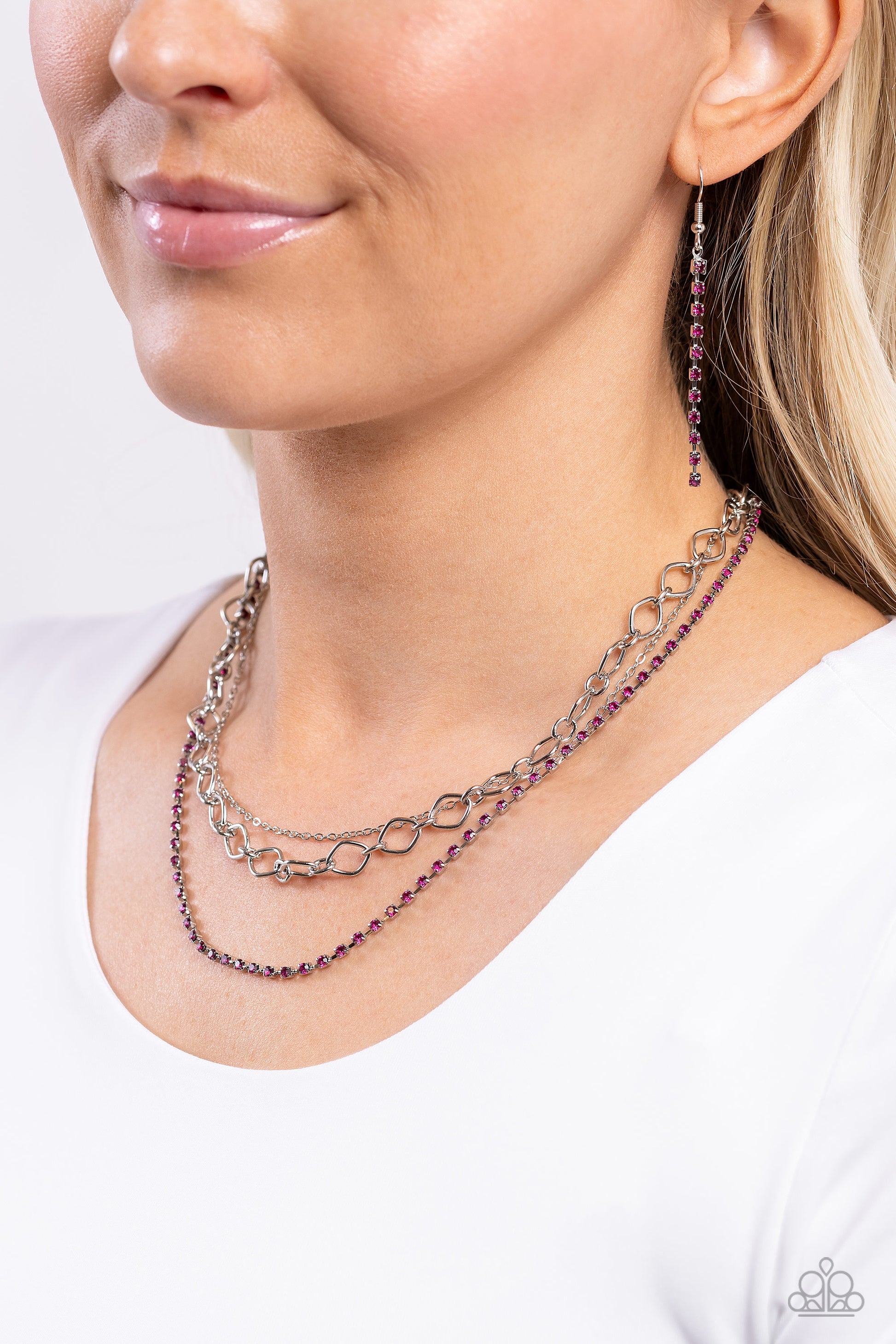 Paparazzi Accessories Tasteful Tiers - Pink A dainty strand of fuchsia rhinestones, set in silver square fittings, joins a dainty silver strand of silver chain and a silver oval link chain below the collar, creating refined layers. Features an adjustable