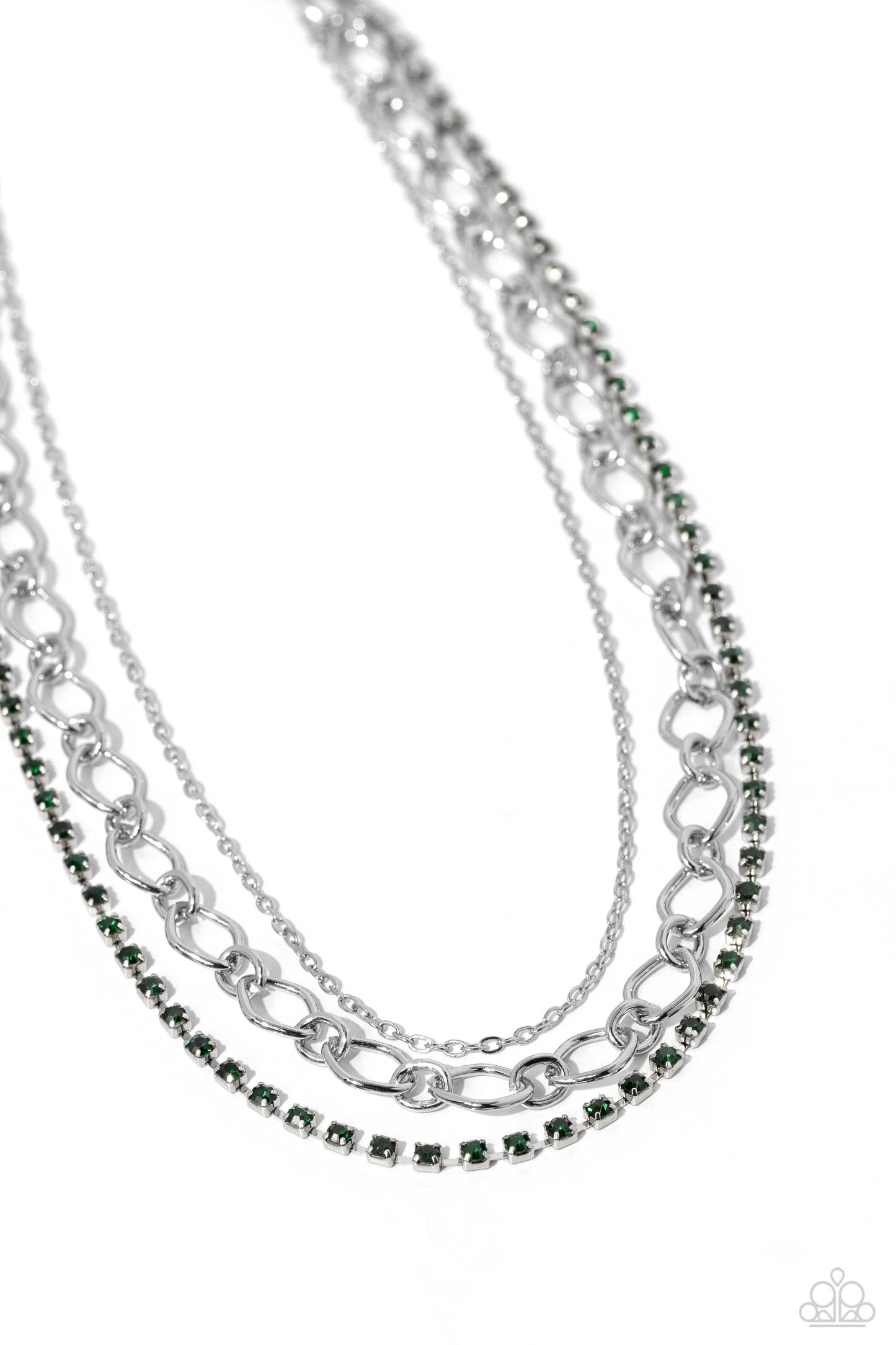 Paparazzi Accessories Tasteful Tiers - Green A dainty strand of emerald green rhinestones, set in silver square fittings, joins a dainty silver strand of silver chain and a silver oval link chain below the collar, creating refined layers. Features an adju