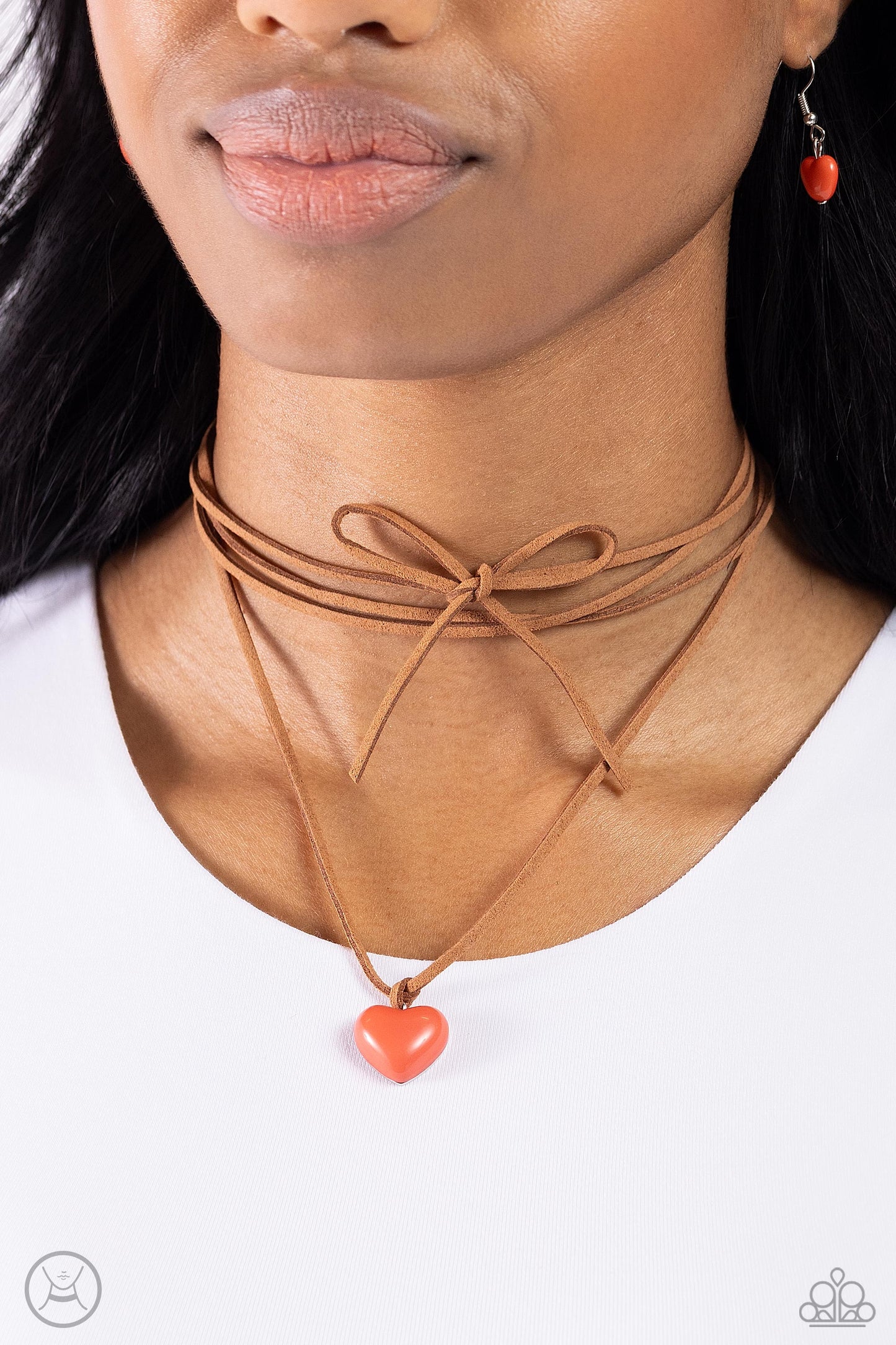 Paparazzi Accessories Wanderlust Wardrobe - Orange A lengthened strip of brown suede wraps around the neck, creating a layered choker necklace. A Burnt Sienna heart, swings from the ends for a wanderlust finish. Sold as one individual choker necklace. Inc