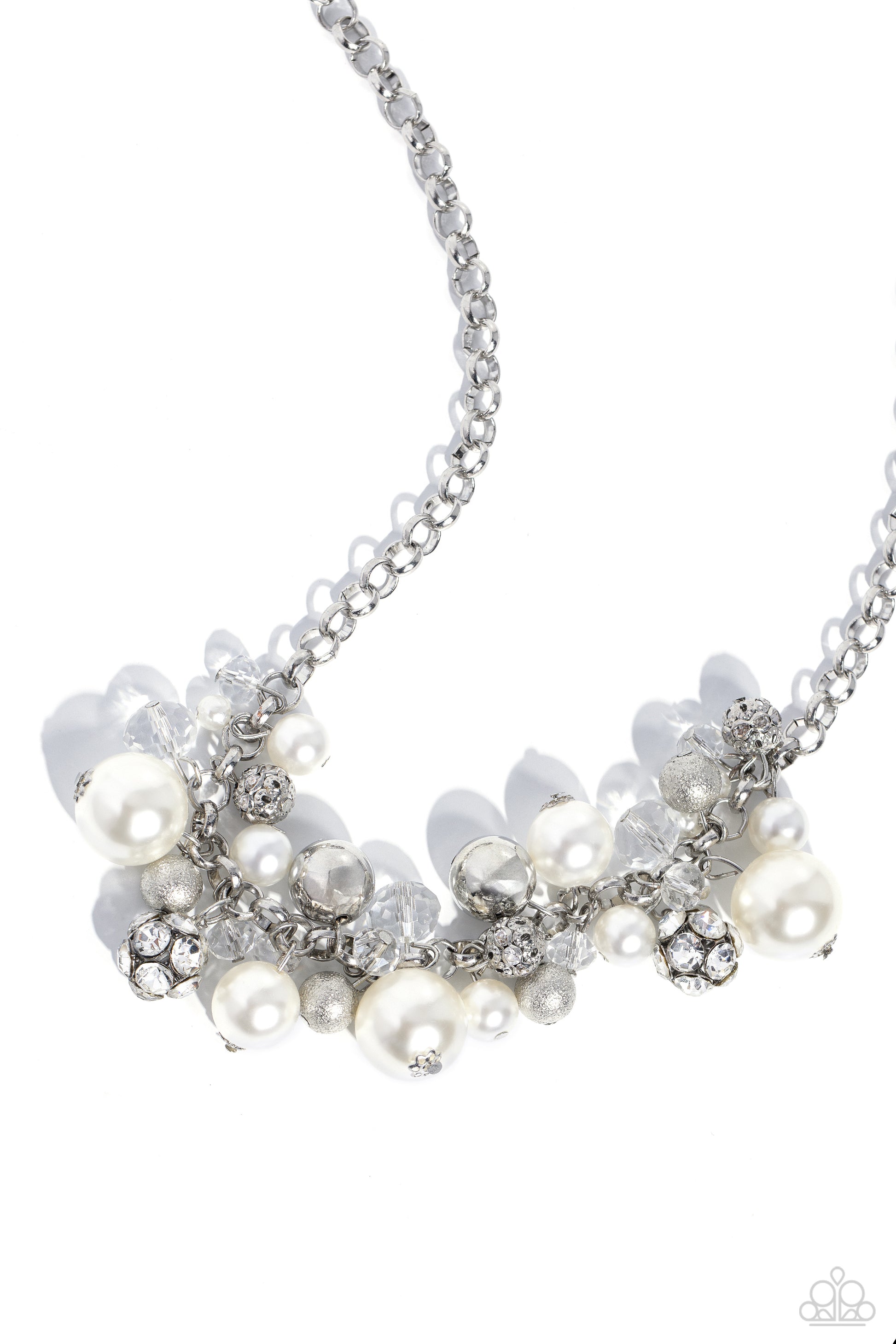 Paparazzi Accessories Corporate Catwalk - White A collection of bubbly white pearls, glittery crystal-like beads, silver beads, some embossed in shimmer, and gem-encrusted beads swing from the bottom of a chunky silver chain, creating an elegantly cluster