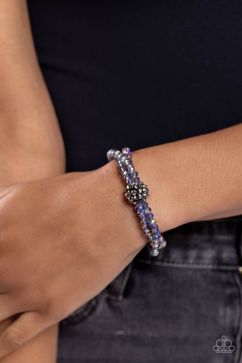 Paparazzi Accessories Twisted Theme - Multi Featuring faceted finishes, oil spill beads are threaded along three stretchy bands around the wrist. Encrusted in gunmetal spiky-like details, an oversized ball twists at the center of the wrist for a fierce in
