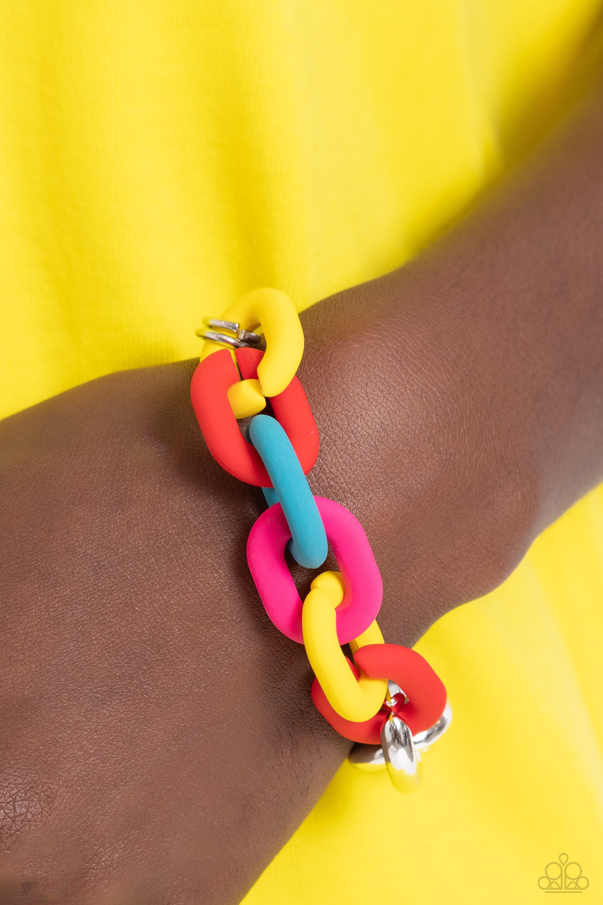 Paparazzi Accessories Candid Contrast - Red A strand of oversized silver curb chain collides with red, High Visibility, turquoise, and Pink Peacock acrylic curb links to create an abstract blend of grit and color. The oversized links of the colored curb c