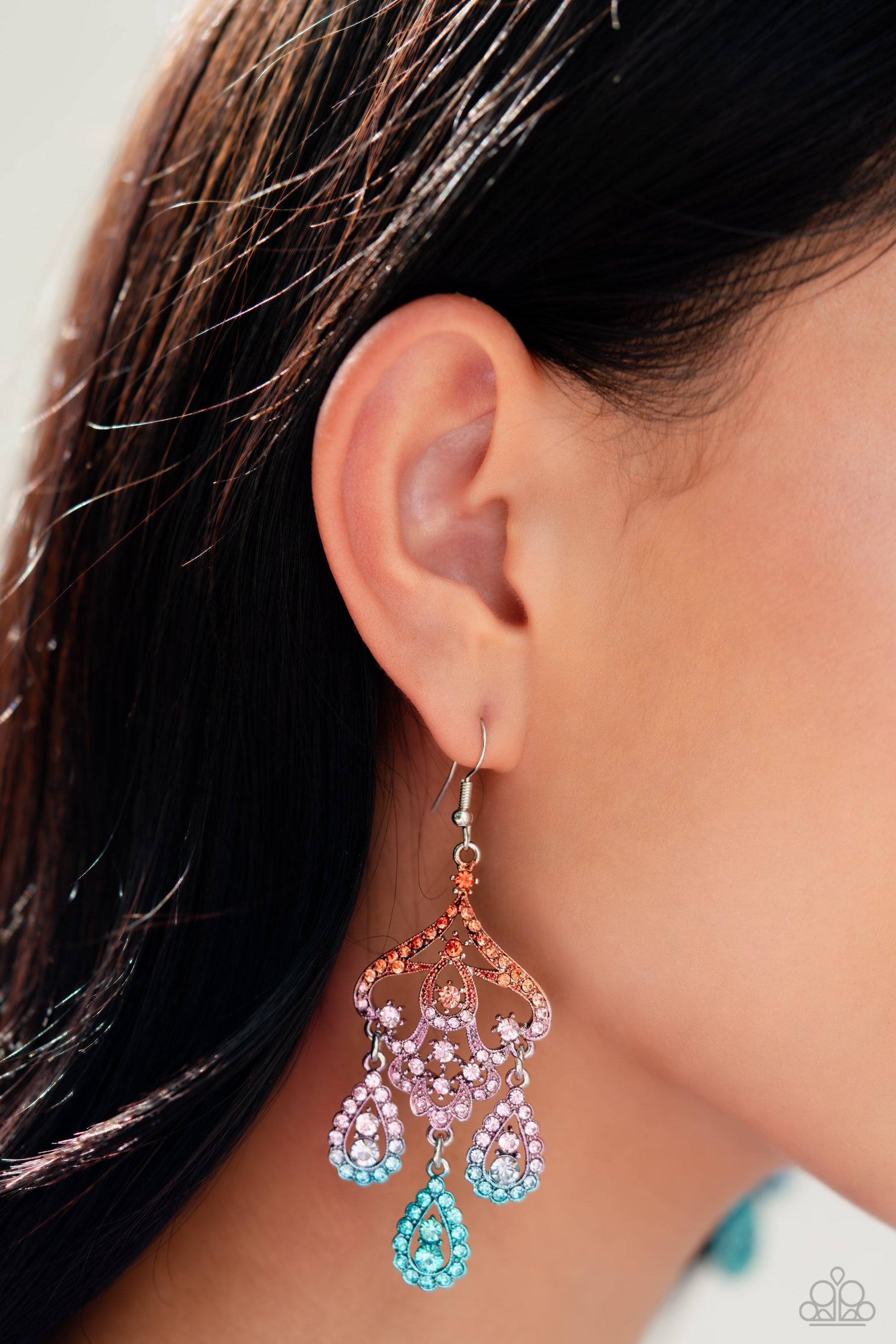 Paparazzi Accessories Chandelier Command - Multi Three rhinestone-encrusted teardrops drip from the bottom of an ornate decorative frame, creating an elegant fringe. The decorative frame swirls with ombré rhinestones that go from orange to pink to blue sh