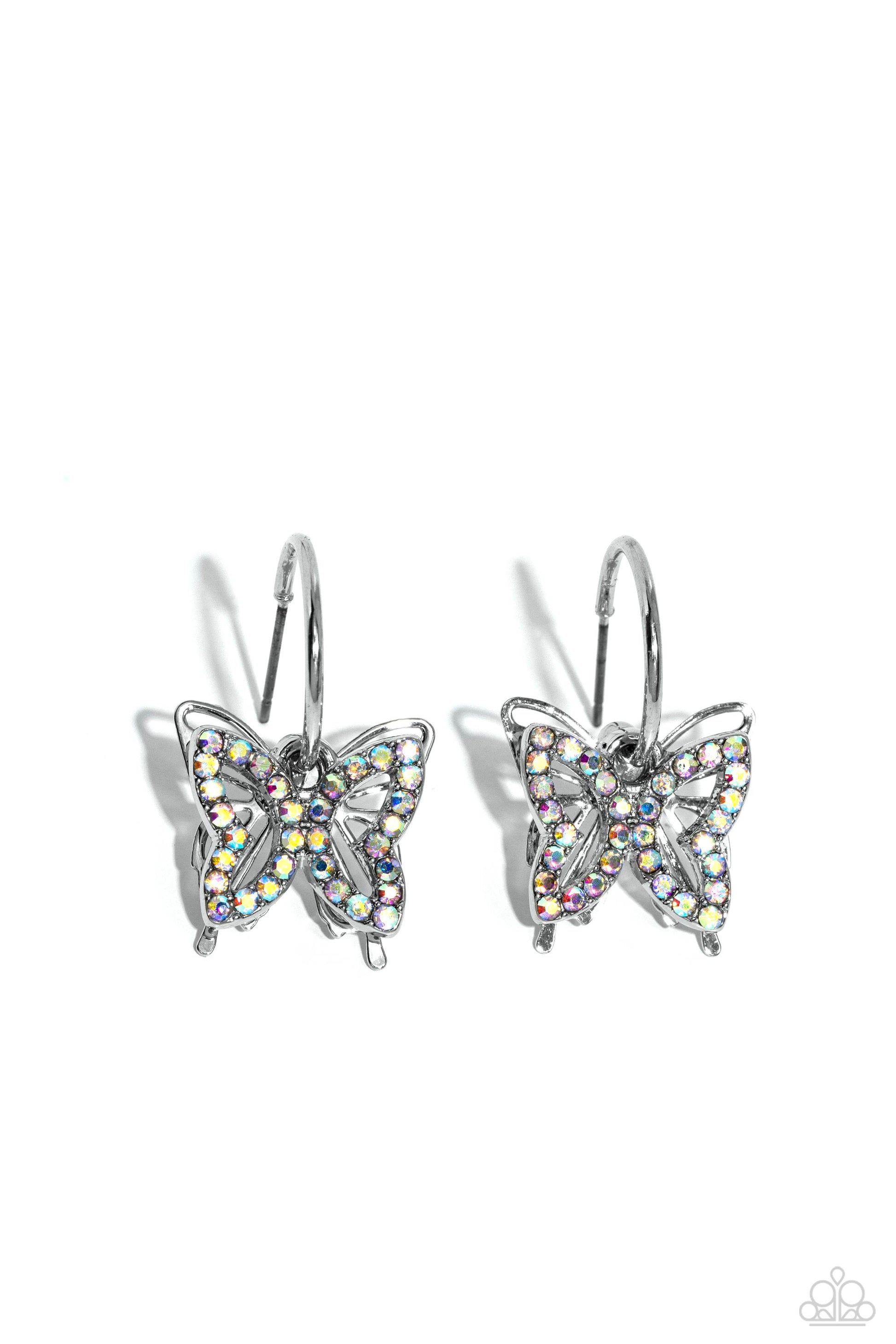 Paparazzi Accessories Lyrical Layers - Multi A small, skinny, shiny silver hoop curves around the ear in a timeless fashion. A shiny silver ball is affixed to the end of the hoop, reminiscent of a barbell fitting. An iridescent rhinestone-encrusted butter