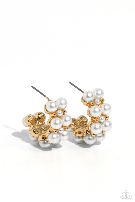 Paparazzi Accessories White Collar Wardrobe - Gold Two rows of bubbly white pearls stack and form into a scalloped pattern. Daintily curling around the ear, the bubbly effect of the high-sheen gold studs and daintier pearls separating the larger pearls cr