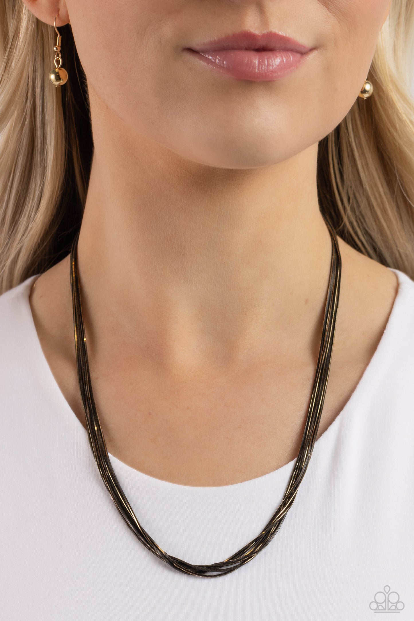 Paparazzi Accessories Salvaging Sass - Black Featuring shiny gold and glistening gunmetal links, six strands of slim snake chains drape across the chest for an edgy mixed metallic finish. Features an adjustable clasp closure. Sold as one individual neckla