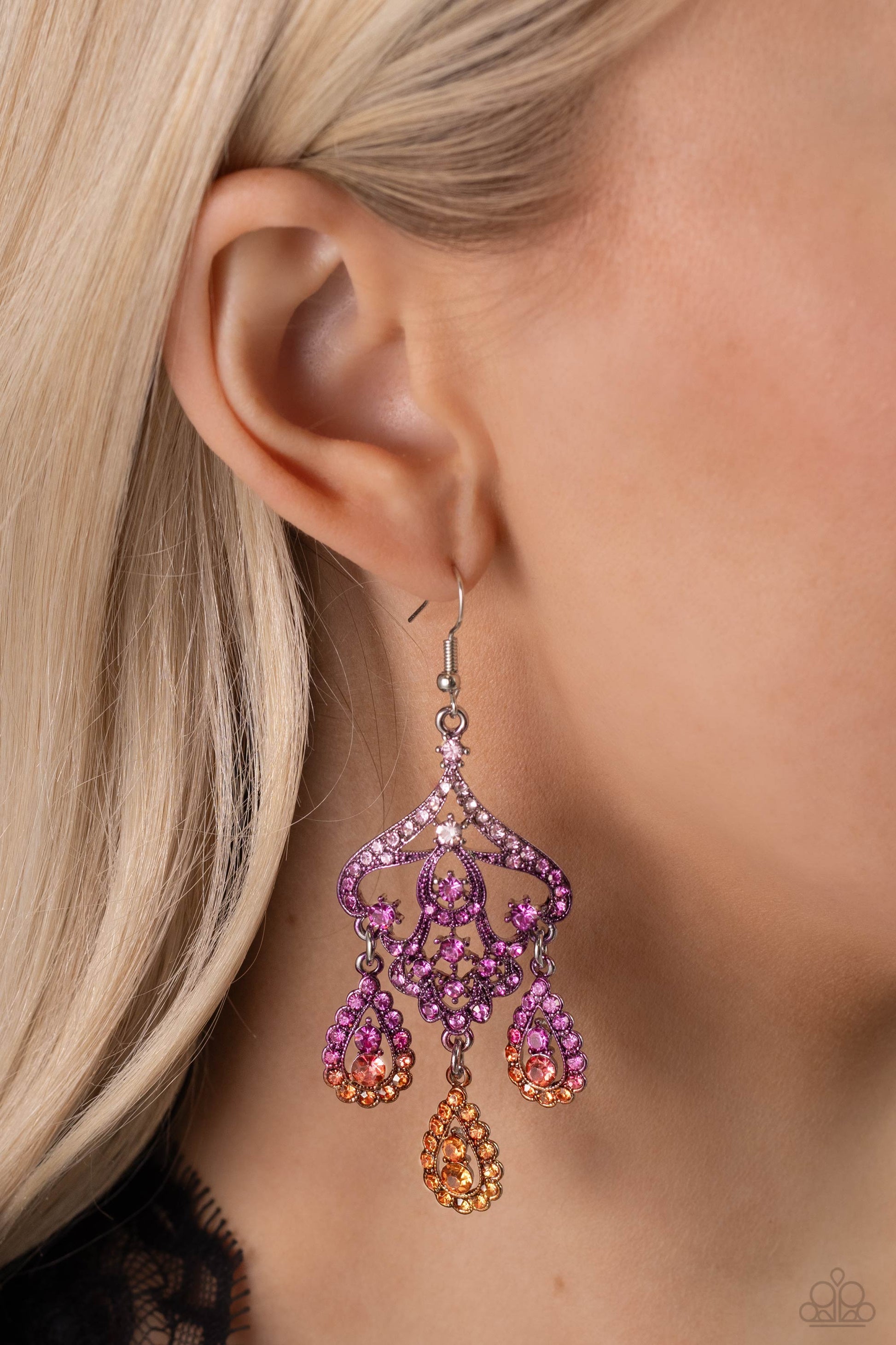 Paparazzi Accessories Chandelier Command - Multi Three rhinestone-encrusted teardrops drip from the bottom of an ornate decorative frame, creating an elegant fringe. The decorative frame swirls with ombré rhinestones that go from pink to purple to orange