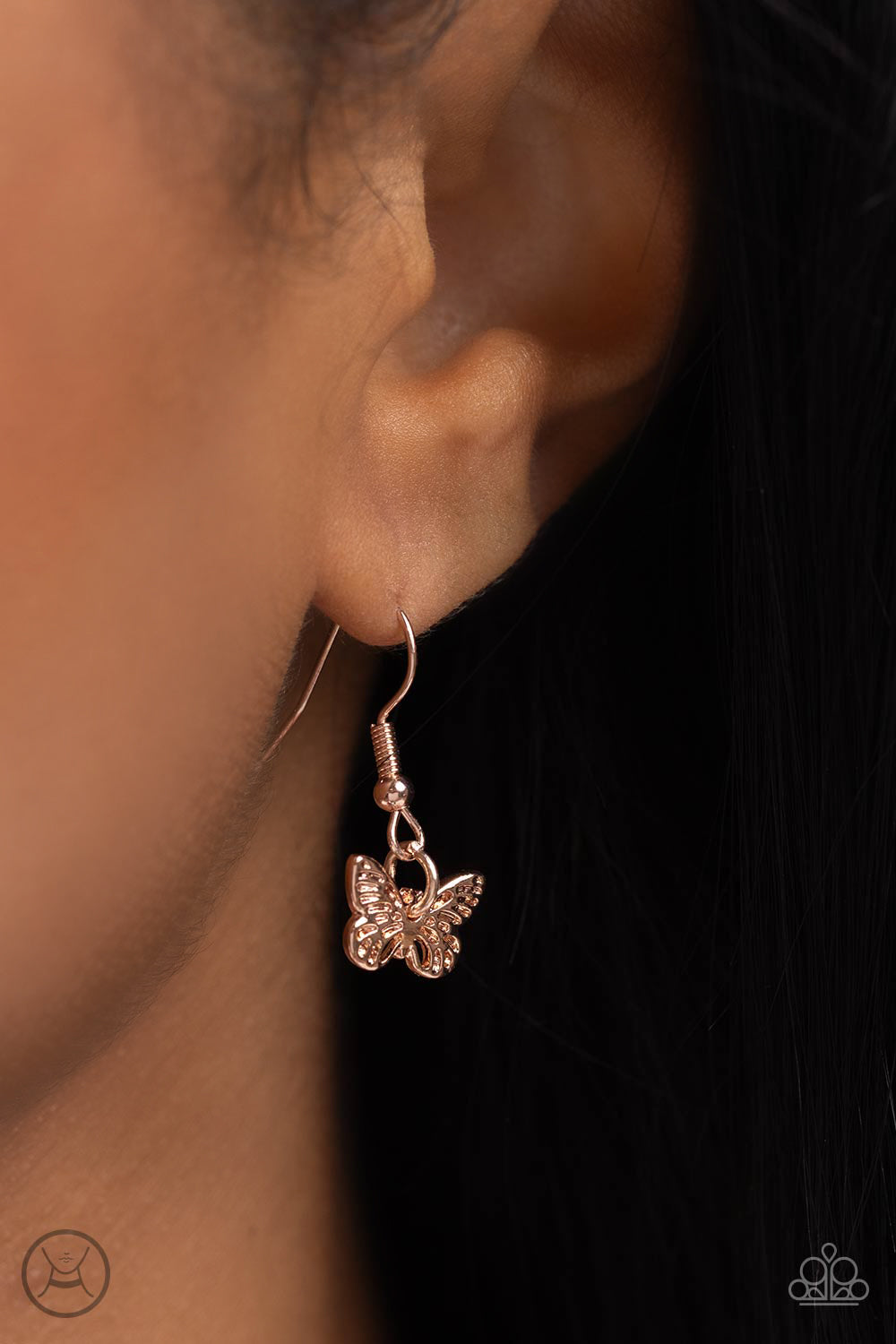 Paparazzi Accessories Butterfly Beacon - Rose Gold Floating along a dainty rose gold chain, a collection of ornate rose gold butterflies coalesces down the neckline for a whimsical finish. A larger rose gold butterfly, featuring the same ornate detail swi