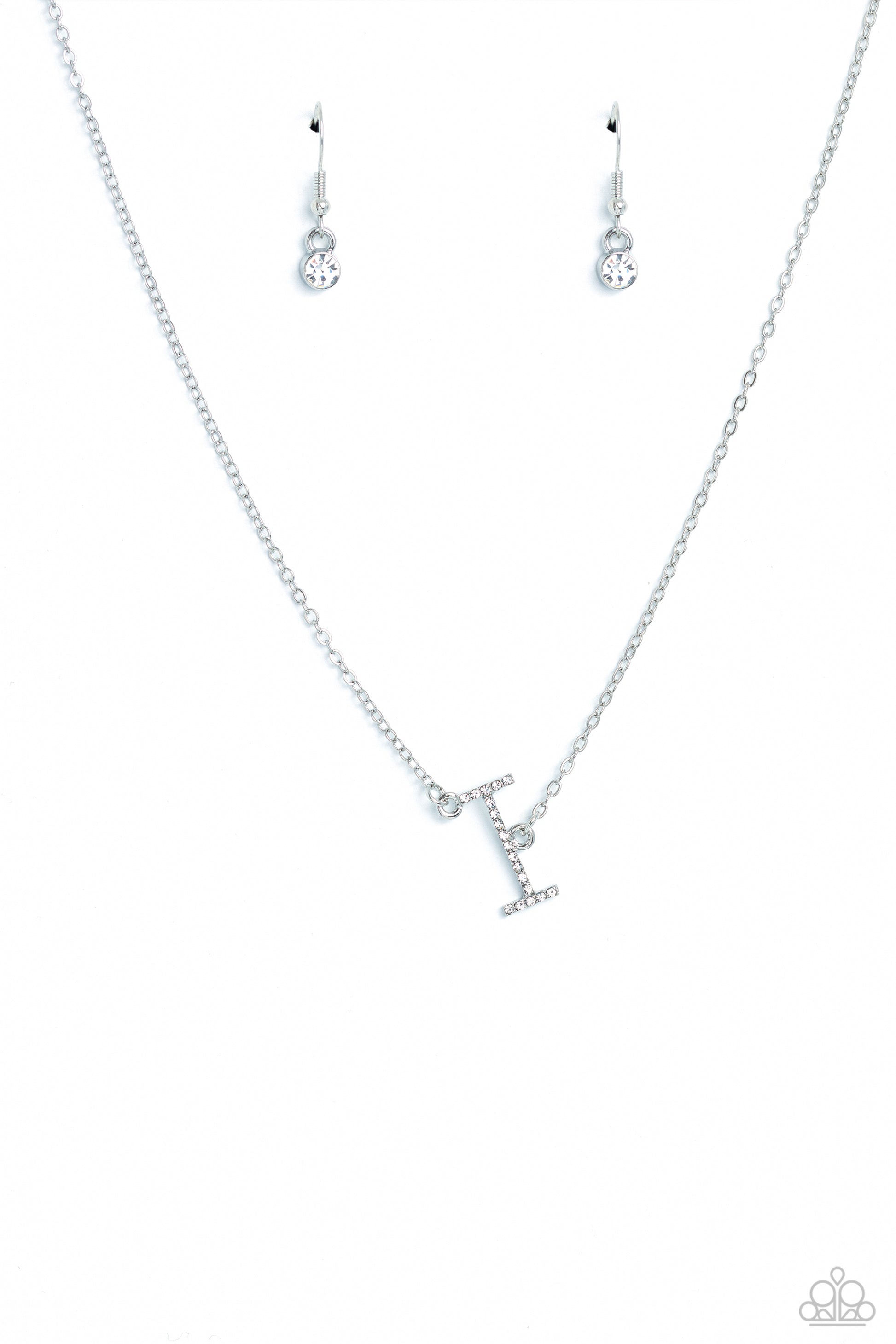 Paparazzi Accessories INITIALLY Yours - I - White Embossed with dainty white rhinestones, a silver letter "I" hovers below the collar from a dainty silver chain, for a sentimentally simple design. Features an adjustable clasp closure. Sold as one individu