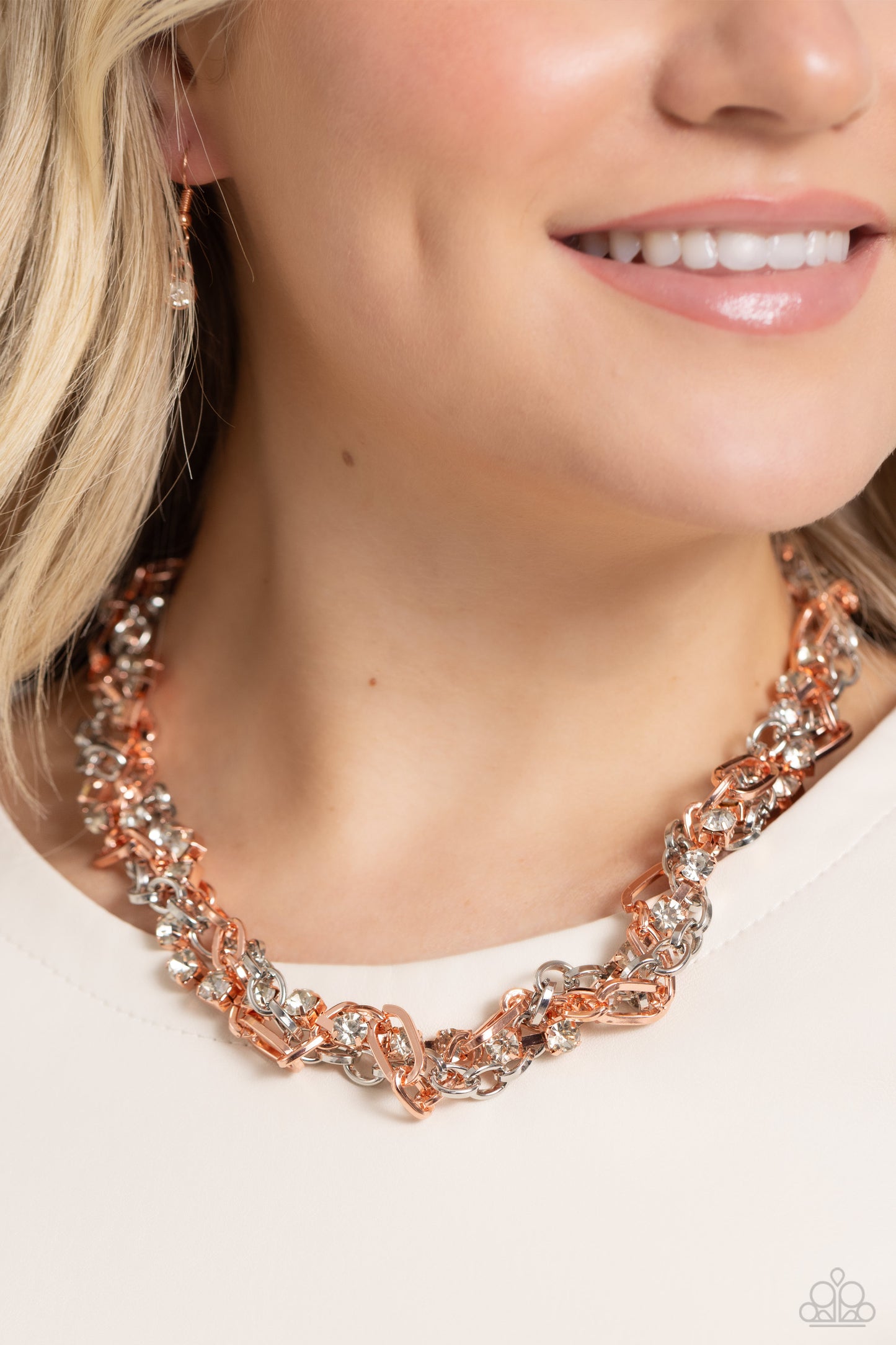 Paparazzi Accessories Totally Two-Toned - Copper Mismatched strands of glistening shiny copper and silver oval links are intertwined with a row of sparkling, square-cut, white rhinestones encased in sleek shiny copper fittings, resulting in a twisted coll