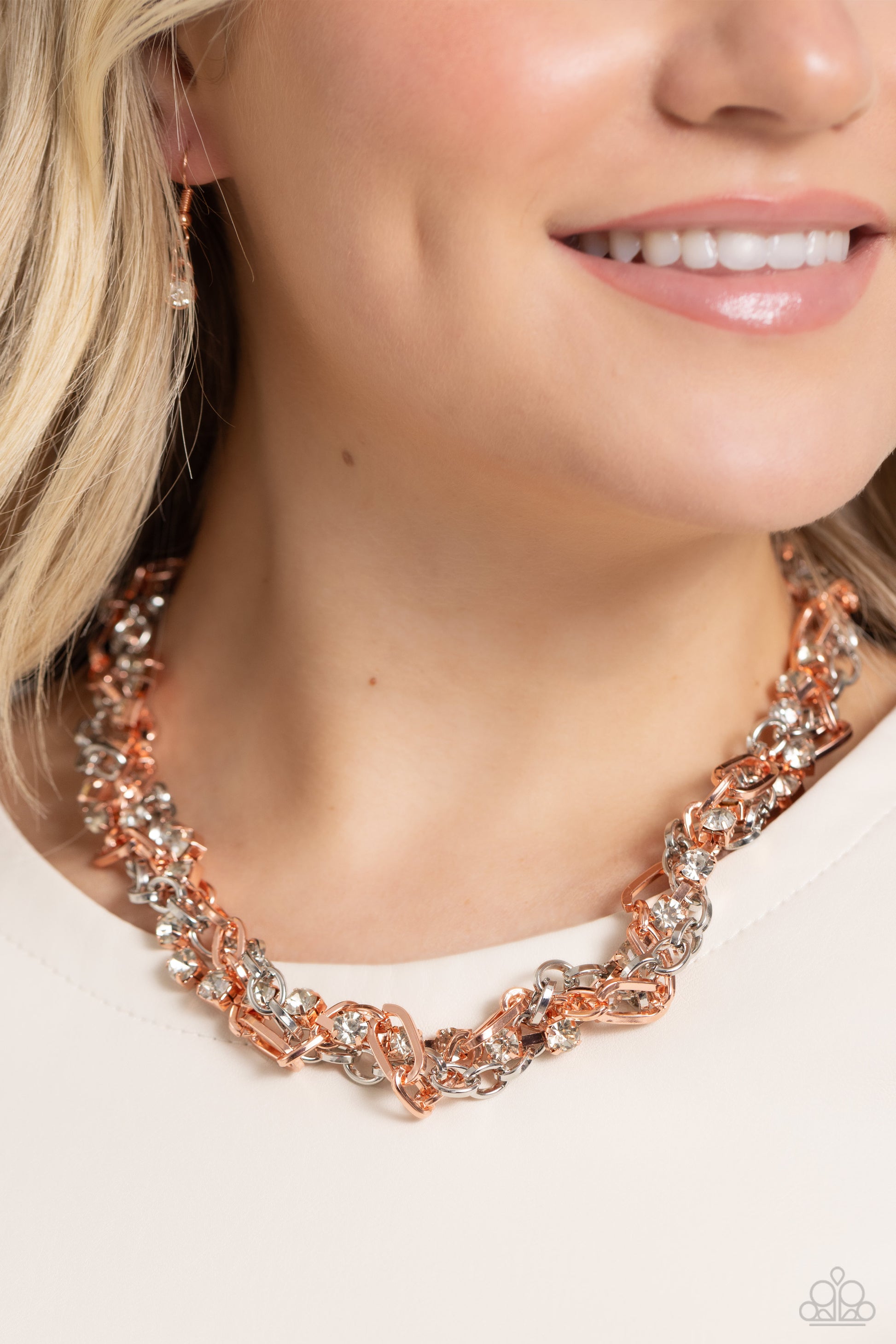 Paparazzi Accessories Totally Two-Toned - Copper Mismatched strands of glistening shiny copper and silver oval links are intertwined with a row of sparkling, square-cut, white rhinestones encased in sleek shiny copper fittings, resulting in a twisted coll