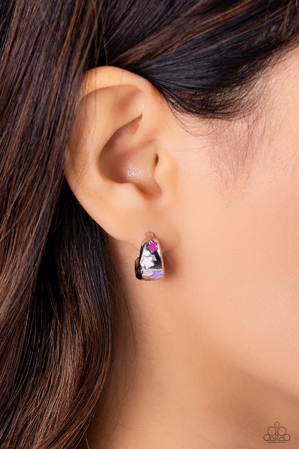 Paparazzi Accessories SCOUTING Stars - Pink Featuring lavender, Rose Violet, and baby pink stars, a thick silver bar curves into a colorfully silver hoop resulting in a basic staple piece. Earring attaches to a standard post fitting. Hoop measures approxi