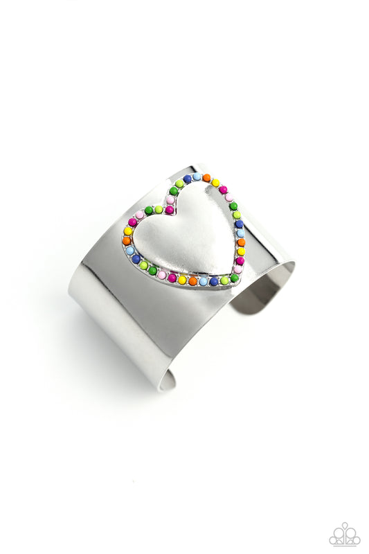 Paparazzi Accessories Cuffing Season - Multi Featuring Rose Violet, light pink, Classic Green, Kohlrabi, Persian Jewel, Summer Song, High Visibility, red, and orange beads, the center of a thick silver cuff swoops and curls into a charming heart, creating