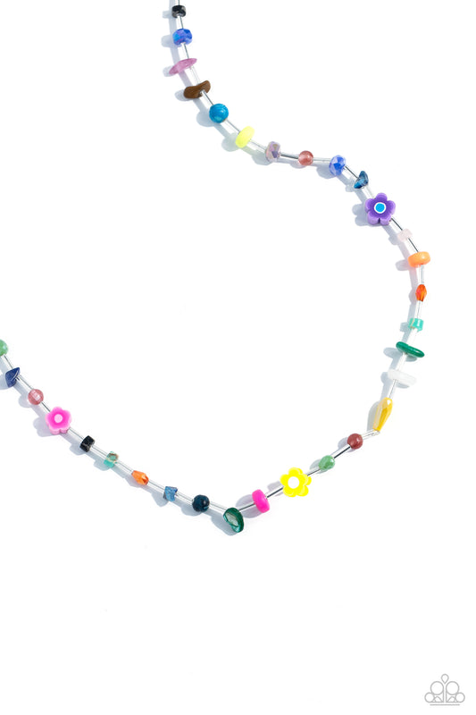 Paparazzi Accessories Ambitious Assortment - Multi Infused on an invisible wire, an assortment of multicolored beads, acrylics, and chiseled stones alternating with dainty silver rods coalesce around the neckline for a youthful pop of color. Features an a