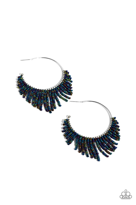 Paparazzi Accessories Tailored Tassel - Multi Cascading strands of oil spill seed beads stream out from the bottom of a classic silver hoop, resulting in a flirtatiously tasseled look. Earring attaches to a standard post fitting. Hoop measures approximate