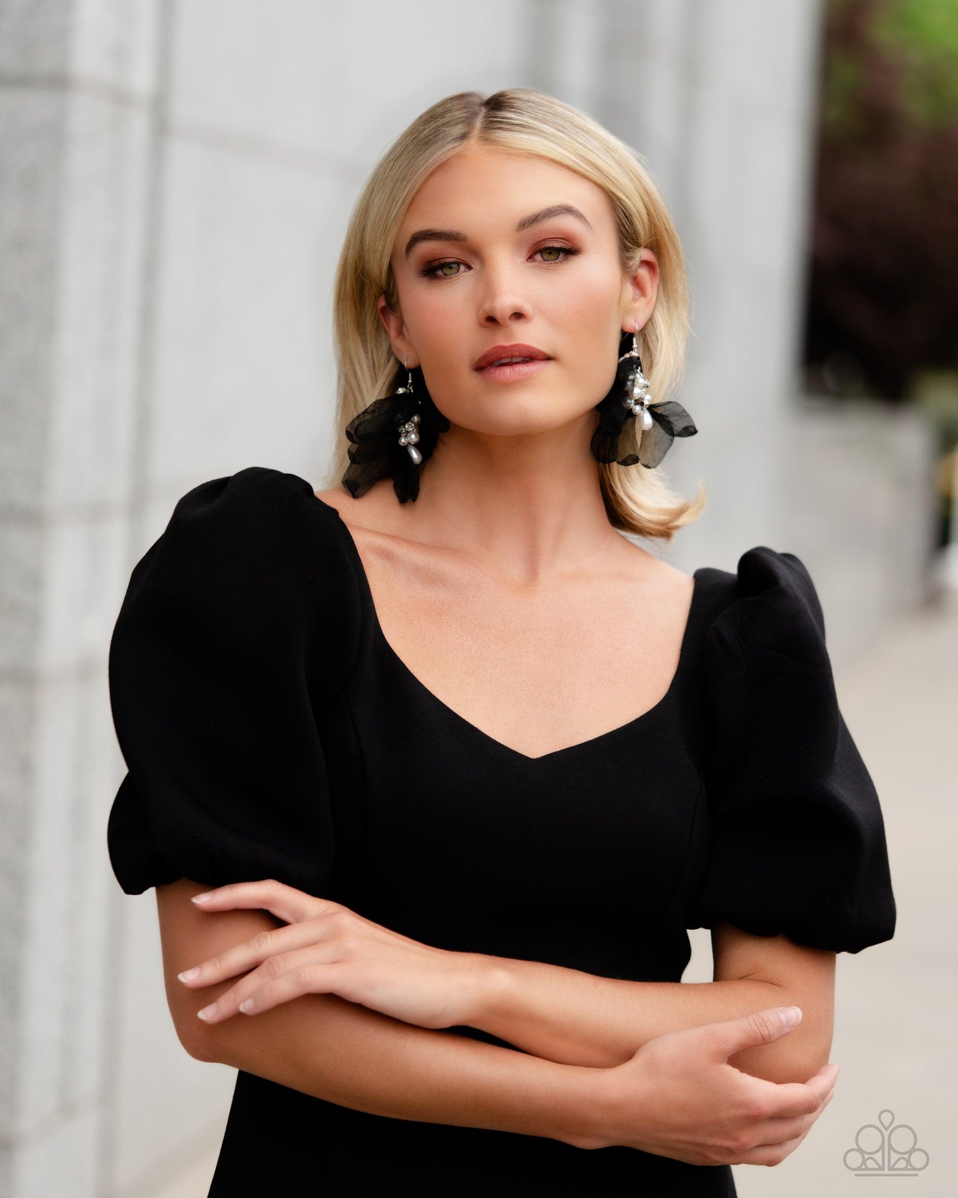 Paparazzi Accessories Cosmopolitan Charisma - Black Featuring a layered motif, elongated black silk petals are separated by a sprinkle of white gems in silver fittings that mingle with a cluster of dreamy white pearls, creating a high-society fringe. Earr