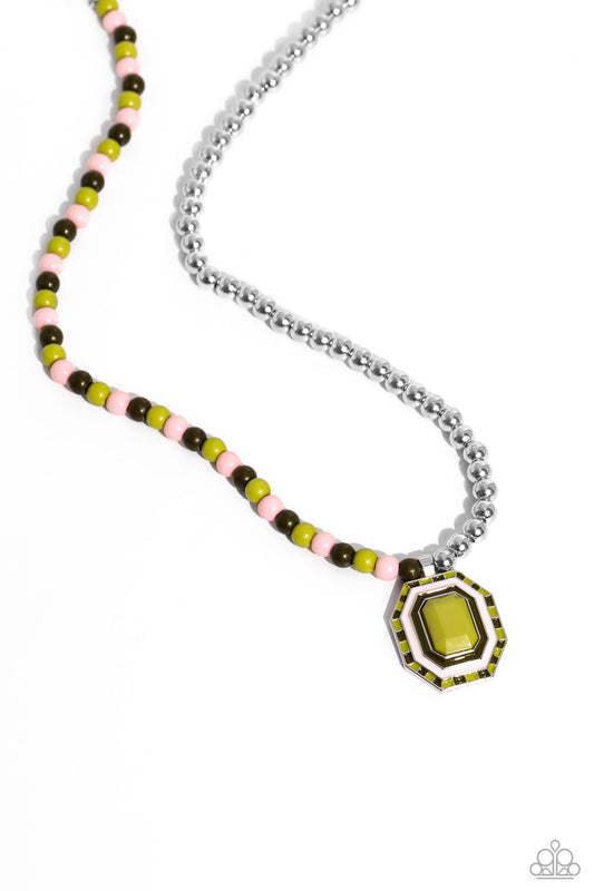 Paparazzi Accessories Contrasting Candy - Green A strand of silver beads collides with Leek Green, Crystal Rose, and olive glossy beads that lay on the opposite side to create a contrasting blend of color and sheen. An oversized emerald-cut pendant featur