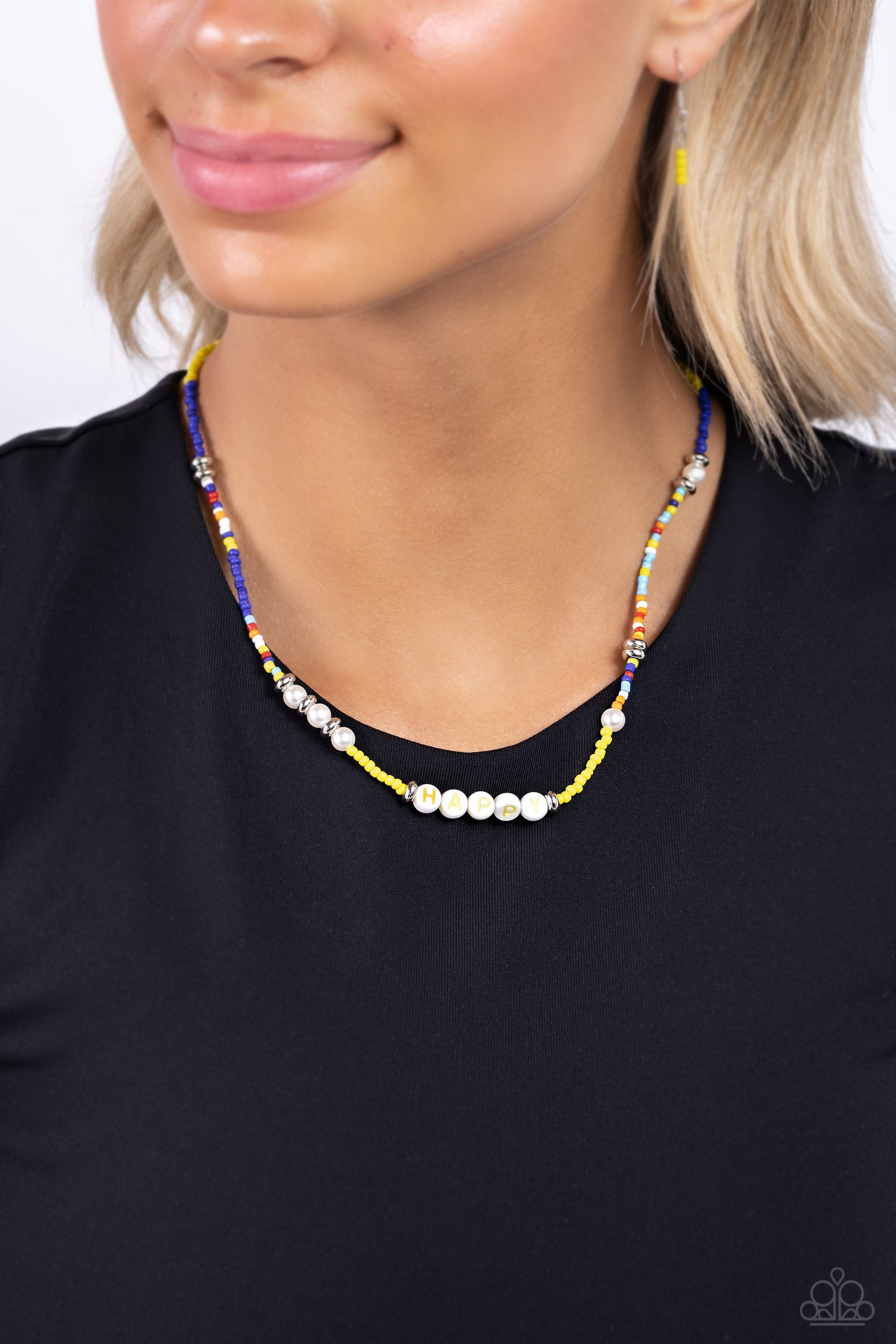 Paparazzi Accessories Happy to See You - Yellow Infused along an invisible string, white pearls, multicolored seed beads, silver accents, and white beads spelling out the word "HAPPY" in yellow lettering wrap around the neckline for an optimistic, youthfu