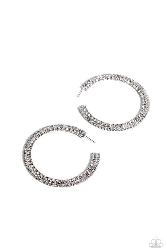 Paparazzi Accessories Scintillating Sass - White Glittery white rhinestones are encrusted along the front and side of a textured tread-like oversized white hoop for a sassy finish. Earring attaches to a standard post fitting. Hoop measures 2 1/2" in diame