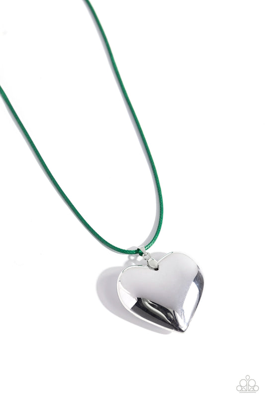 Paparazzi Accessories Devoted Daze - Green An oversized, sleek silver heart glides along a vibrant green cord, creating a flirtatious pendant below the collar. Features an adjustable clasp closure. Sold as one individual necklace. Includes one pair of mat