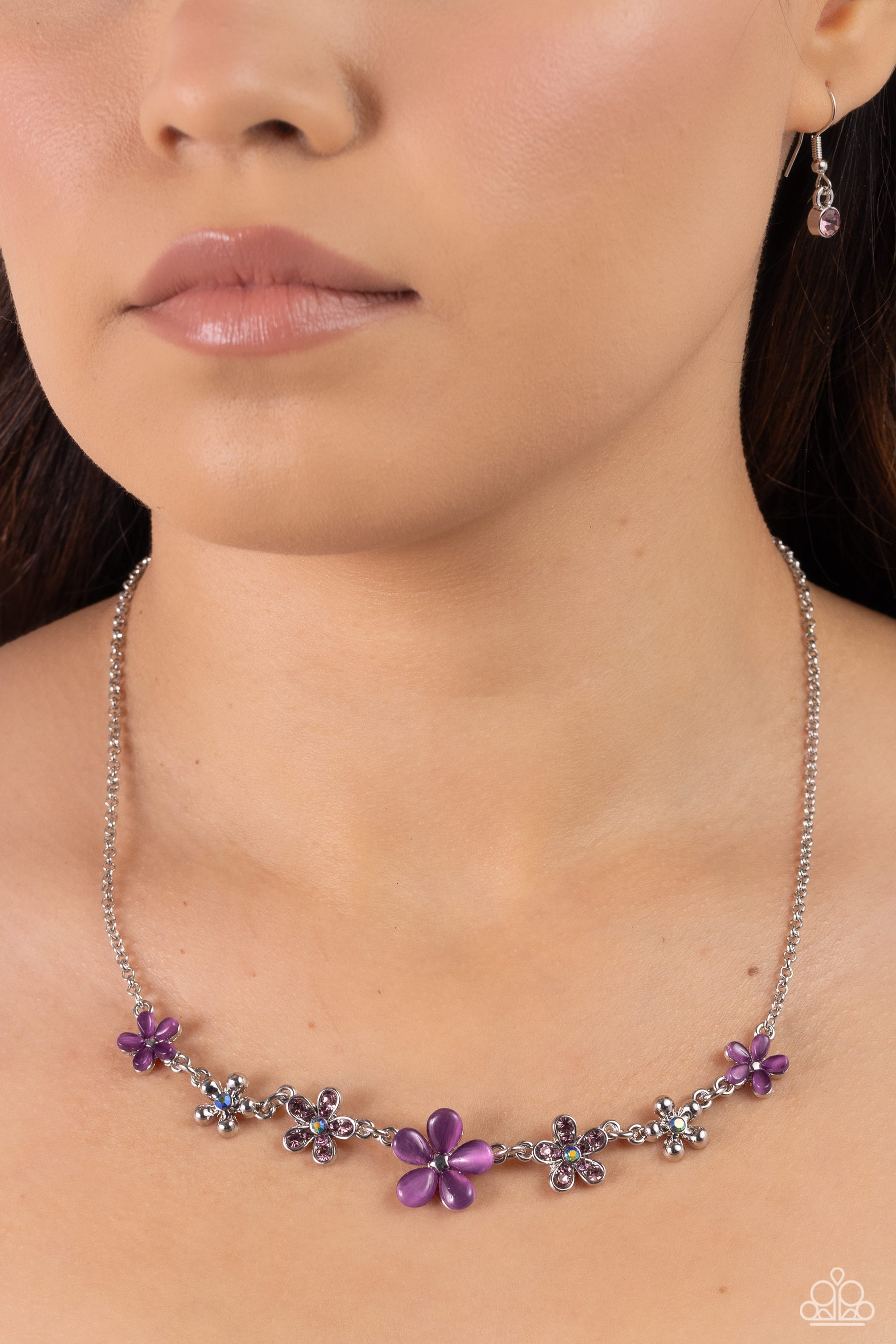 Paparazzi Accessories Spring Showcase - Purple Purple cat's eye stone petals bloom from silver stud centers, linking into various sizes of ethereal blossoms below the collar on a dainty silver chain. Silver-studded petals bloom from blue iridescent rhines