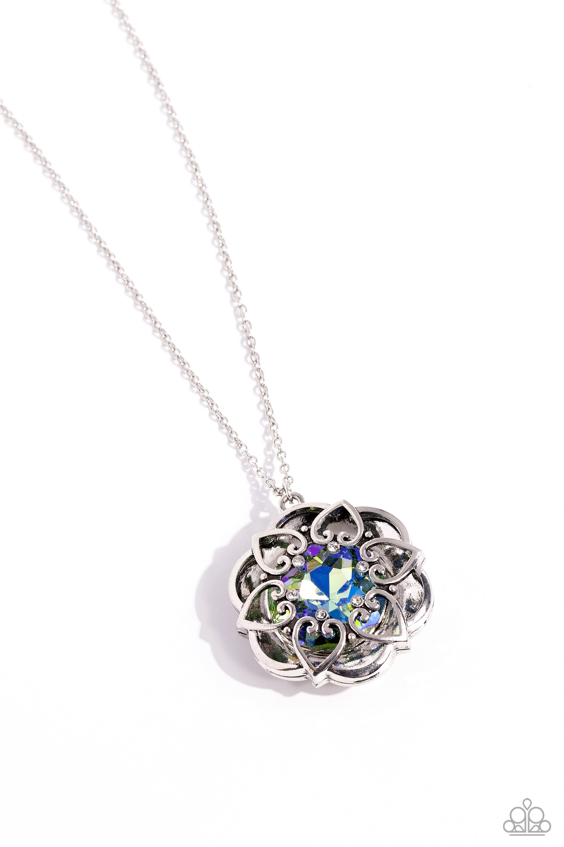Paparazzi Accessories Flowering Fantasy - Green Pressed in the center of an oversized, thick silver floral frame, a green UV gem glimmers from the chest. Intricate silver hearts, sprinkled with dainty white rhinestones, encircles the inner circle of the f