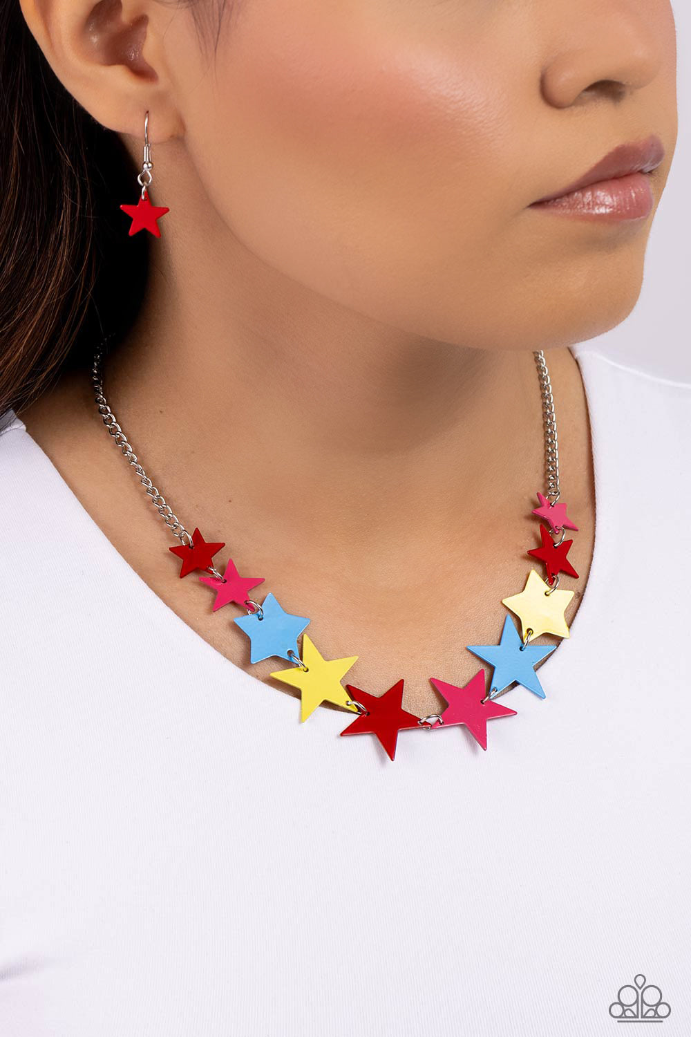 Paparazzi Accessories Starstruck Season - Red Featuring various sizes, a collection of red, High Visibility, Poppy Red, and blue stars cascade around the neckline, on a classic silver chain creating an intense, starstruck statement. Features an adjustable