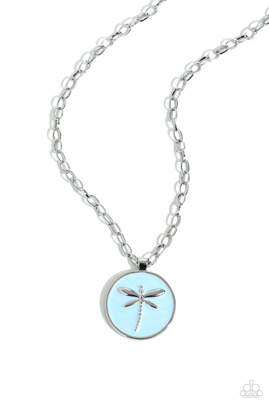 Paparazzi Accessories Decorative Dragonfly - Blue Featuring a light blue pearl paint backdrop, a silver dragonfly dances at the center of a silver pendant adding an elegantly rugged aesthetic to a silver link chain. Features an adjustable clasp closure. S